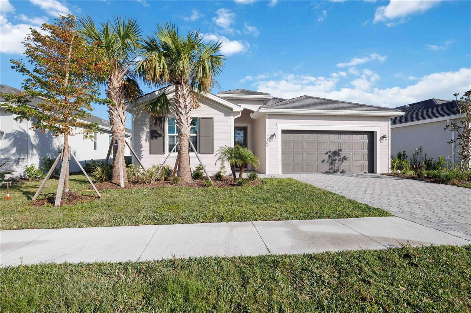 Brand New – Never Lived-In 4BR/3BA Trevi Model with Lake View in Antigua at Wellen Park!
This move-in-ready home features a tile roof, storm impact windows and doors, and a spacious open floor plan ideal for entertaining. Enjoy a gourmet kitchen with a large island and custom pantry, elegant tile flooring throughout, high ceilings, and a freshly painted interior. The extended paver driveway adds curb appeal, while the screened lanai offers peaceful lake views and wildlife watching. The owner’s suite includes dual walk-in closets and a spa-like bath. Optional custom pool package with cage and pavers available for $65K. Located in a secure, vibrant community near dining, shopping, outdoor recreation, and the Atlanta Braves Spring Training facility. Skip the wait for new construction – this upgraded home is ready now!
Wellen Park is a planned community in Sarasota County, Florida, near North Port. It is one of the fastest-growing master-planned communities in the U.S., known for its vibrant lifestyle, modern amenities, and scenic surroundings. The area features diverse residential neighborhoods with options like single-family homes, villas, and townhomes that appeal to families and retired folks alike. Golf enthusiasts will love the proximity to nearby courses, while sports fans can enjoy the Atlanta Braves Spring Training facility. This upgraded, move-in-ready home lets you skip the wait for construction. Embrace the lifestyle you deserve!
