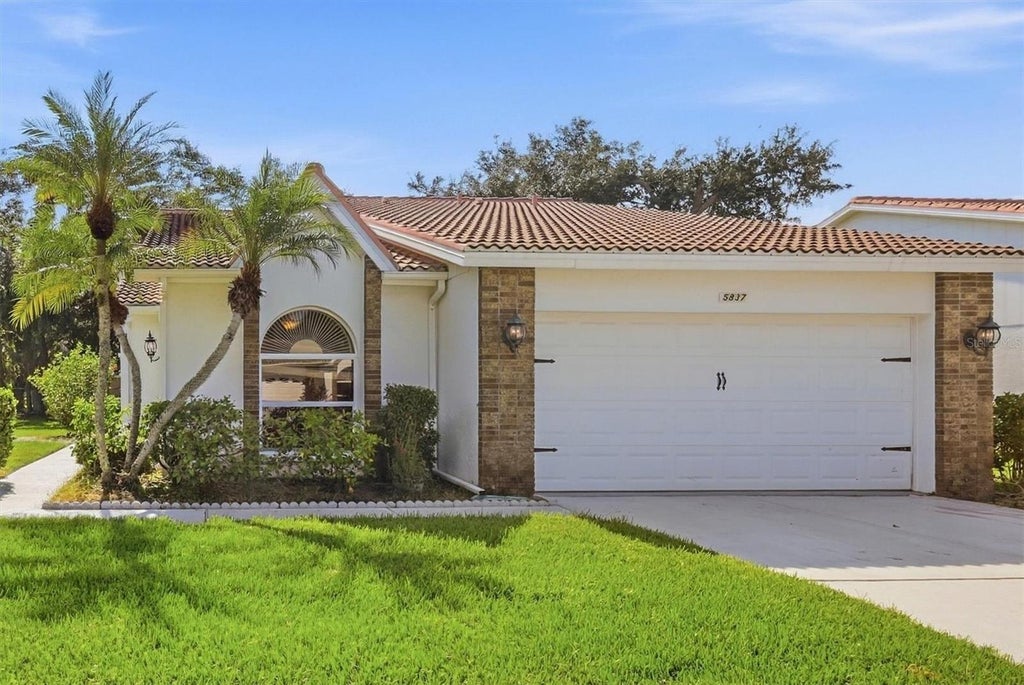 Photo of 5837 Garden Lakes Drive, Bradenton, FL 34203 (MLS # A4707178)