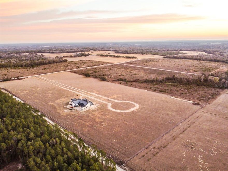 An exclusive opportunity in one of Hernando County’s newest gated estate enclaves. This exclusive Community will feature only 10 total estate lots, with just 9 remaining, as one homesite is already under construction— this is a rare chance to secure a private three-acre estate lot designed for those who want space, privacy, and the freedom to build something truly exceptional. The community is planned to be gated, with a private paved road and curated landscaping to be installed, creating a refined and cohesive estate setting. Homes within the subdivision must be Modern Country Craftsman in design, with minimum square footage requirements between 5,000 and 10,000 square feet under roof, ensuring architectural consistency throughout the community. This neighborhood was thoughtfully created for buyers who appreciate craftsmanship, space, and lifestyle — including those looking to design expansive garages for luxury vehicles, exotic sports cars, or curated collections. The generous acreage allows for custom floorplans, oversized garages, and resort-style outdoor living. With limited availability, premium lot sizes, and strict architectural standards, this subdivision represents a true estate-level offering — where privacy, prestige, and possibility meet. Offering the feel of true country living yet located just minutes from the charm and conveniences of Brooksville, it provides the perfect balance of seclusion and accessibility. Enjoy easy access to I-75 (approximately 20 minutes), the 589 Expressway (approximately 15 minutes), and a drive of under an hour to Tampa International Airport, making both daily life and travel effortless. Opportunities like this don’t come often. Secure your place among a select group of owners and build the legacy home you’ve been waiting for.