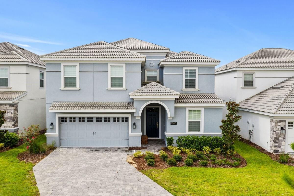 Currently in a short term rental program. This floorplan has the option of being used as a 8 bedroom with a movie room or a 9 bedroom as it is currently set up. This home is perfect for a large family vacations in the midst of the Orlando entertainment hub. There's plenty of space for everyone to hang-out or have private time. The private pool deck & lanai is screened-in. Lounge in the sun, relax in the spillover spa or enjoy a bite al fresco poolside. Not overlooked by rear neighbors due to the wall.
The open-floor concept is great for everyone to socialize no matter where their activity takes them - the living, dining, or kitchen area. The fully-equipped kitchen has a luxurious feel with its dark cabinetry against granite counters and all stainless steel appliances. The kitchen bar has additional seating for 5 while the dining table seat 10. In the game room, shoot some pool or play air hockey.
Located in The Retreat at Champions Gate Resort, amenities include The Oasis Clubhouse: Resort Style Pool with Water Slide and Cabanas, Lazy River, Tiki Bar, Fitness Center, Movie Theater, Game Room, Play Ground, Volleyball Courts, Public 18-hole golf course close by, clay tennis courts along with a tennis clubhouse.
