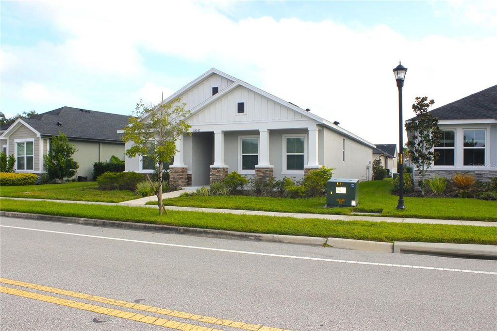 Photo of 28547 Hillcrest Valley Boulevard, Wesley Chapel, FL 33543 (MLS # TB8388801)