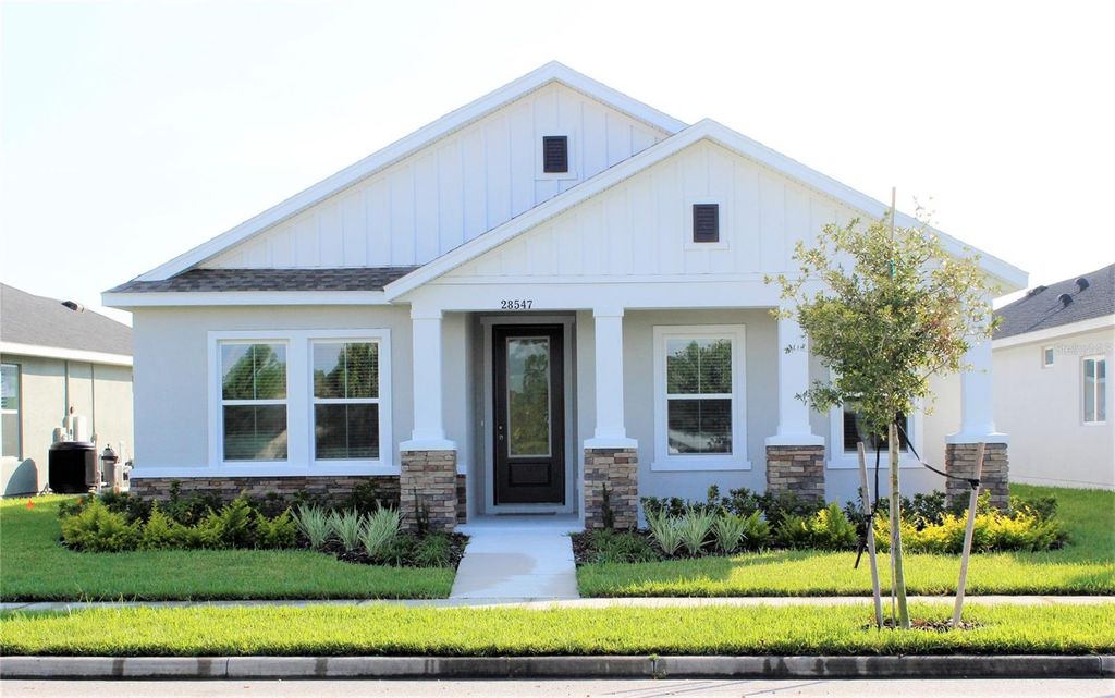 Photo of 28547 Hillcrest Valley Boulevard, Wesley Chapel, FL 33543 (MLS # TB8388801)