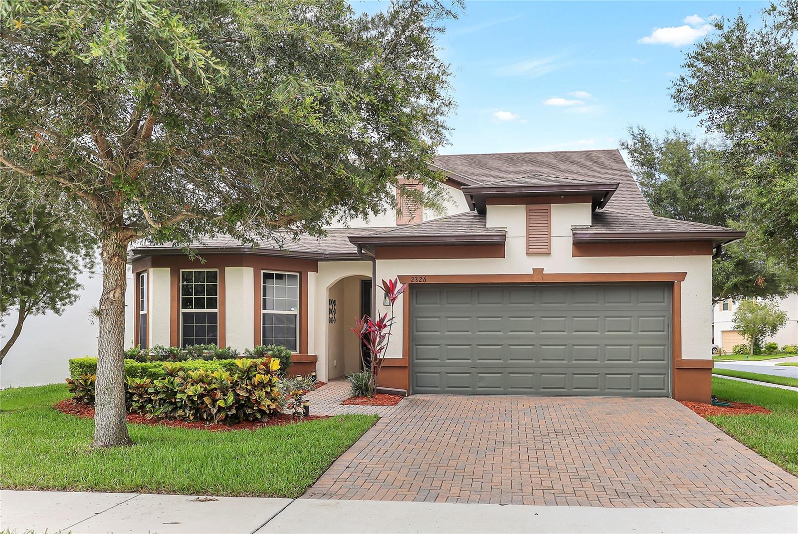 Your dream family home awaits in the gated community of The Reserve at Legacy Park.
Situated on a spacious corner lot, this nearly 2,700 sq. ft. former model home offers 4 bedrooms, 3 full bathrooms, and a large upstairs bonus room—perfect for growing families, multigenerational living, or those needing flexible space to adapt as needs change.
Inside, the open-concept layout features wood-look tile floors, high ceilings, and an abundance of natural light. The kitchen sits at the heart of the home, complete with a large island, granite countertops, solid wood cabinetry, stainless steel appliances, and a walk-in pantry—ideal for family dinners, entertaining, or simply staying connected throughout the day.
The kitchen flows seamlessly into the living and dining areas, creating a central space for movie nights, birthdays, or hosting guests.
The primary suite is privately located on the first floor and includes tray ceilings, a dual-sink bathroom, a spacious walk-in shower with bench, and an oversized walk-in closet. Two additional bedrooms and a full bath are also on the main level. Upstairs, a huge 21x26 bonus room, fourth bedroom, and full bath offer the perfect setup for a teen retreat, in-law suite, or playroom.
A well-appointed laundry room with deep sink and storage, plus a drop zone off the tandem-style garage (with an extra bay for a golf cart or additional storage), adds to the home's everyday functionality.
Step through triple pocket sliders onto the extended screened lanai and into your private, fully fenced backyard featuring a fire pit and peaceful views of mature Magnolia trees—perfect for evenings outside or weekend gatherings.
The Reserve at Legacy Park offers resort-style amenities just down the street, including a pool with pond views, a playground, and a private dog park.
Located in one of Seminole County’s most desirable school zones—with top-rated public schools and close proximity to respected private academies like The Geneva School, Trinity Prep, and Masters Academy—this home offers families access to excellent education in a community known for its safety and convenience. Quick access to 417, 434, I-4, and employers like UCF, Siemens, and AdventHealth makes commuting easy.
This is more than a home—it’s a lifestyle built for connection, comfort, and long-term value