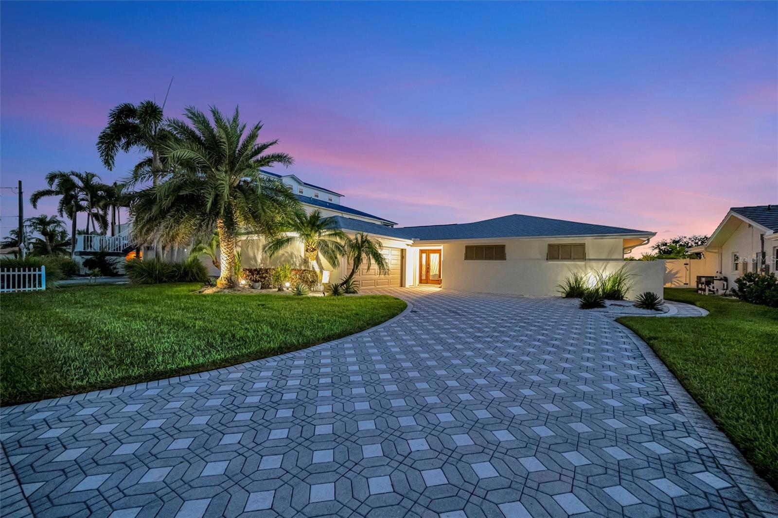 Experience the rare chance to create your own luxury waterfront retreat on one of Treasure Island’s most desirable deep sailboat water canals, offering quick access to Boca Ciega Bay and the shimmering Gulf of Mexico. Set on an expansive 70x120 lot, this 2,716 sq. ft. residence is a blank canvas for your vision, a heated pool, bubbling spa, and fire pit set against wide water views. The home’s generous layout invites effortless entertaining, with multiple gathering areas off the kitchen that flow to the pool deck and dock. The kitchen space, complete with pantry, is ready to be transformed into your dream culinary showpiece, while the formal dining room showcases tranquil water vistas. In the center of the home, a spacious lanai serves as a versatile bonus space — perfect for morning coffee, afternoon yoga, or evening cocktails in a private, breezy setting. The large family room offers a relaxed spot for movie nights or casual get-togethers. The primary suite is ready to become a serene sanctuary, with room for a spa-inspired bath, dual walk-in closets, and an adjacent flex room ideal for an office or expanded retreat. Two additional bedrooms are generously sized, each providing comfort, natural light, and flexibility for guests or family. Additional highlights include an inside laundry room, peace of mind of storm-rated doors and windows, lush landscaping, seawall (2018), dock with 16,000 lb. lift and water/electric, 2025 A/C, 2024 water heater, 2024 pool equipment and travertine flooring in the main living areas. All just minutes to Treasure Island Beach, vibrant dining, boutique shopping, downtown St. Pete, Tampa, and both airports. Bring your imagination — the possibilities are as endless as the views.