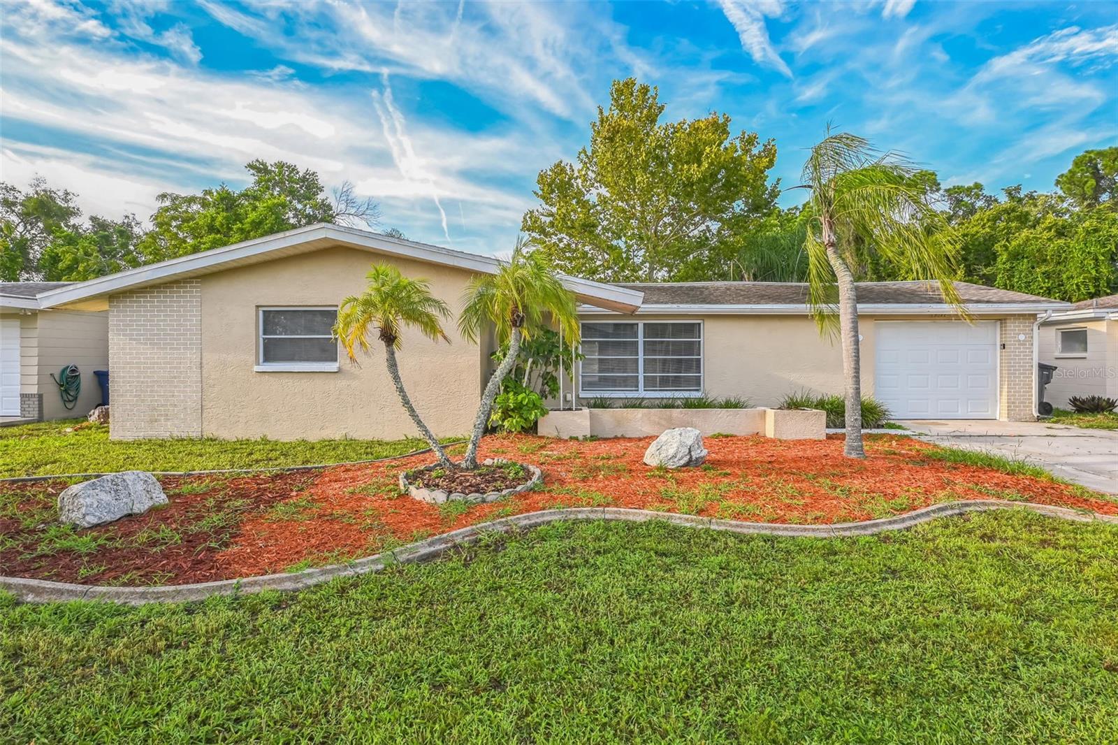 NO HOA! Welcome to this beautifully updated 2-bedroom, 2-bathroom single-family home nestled in a quiet, tree-lined neighborhood of Holiday. With timeless charm and stylish upgrades, this home is the perfect blend of comfort and elegance - just minutes from the beaches, dining, shopping, and the iconic Tarpon Springs Sponge Docks!
Step inside and be greeted by an open, sunlit floor plan with generous living space perfect for relaxing or entertaining. The stunning kitchen boasts stainless steel appliances, quartz countertops, and modern finishes sure to impress any home chef.
Retreat to your spacious master suite, complete with a large closet and a stand-up shower for a spa-like experience. The second bedroom offers flexibility for guests, a home office, or a cozy retreat.
Step outside and enjoy Florida living in your fully fenced backyard—ideal for fun, gardening, or hosting unforgettable gatherings. The enclosed patio adds extra space to unwind and enjoy year-round.
Whether you're looking for a peaceful place to call home or a weekend getaway near the coast, this home offers comfort, style, and convenience.
