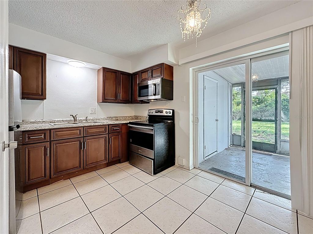 Photo of 2319 18th Avenue SW, Largo, FL 33774 (MLS # TB8486335)