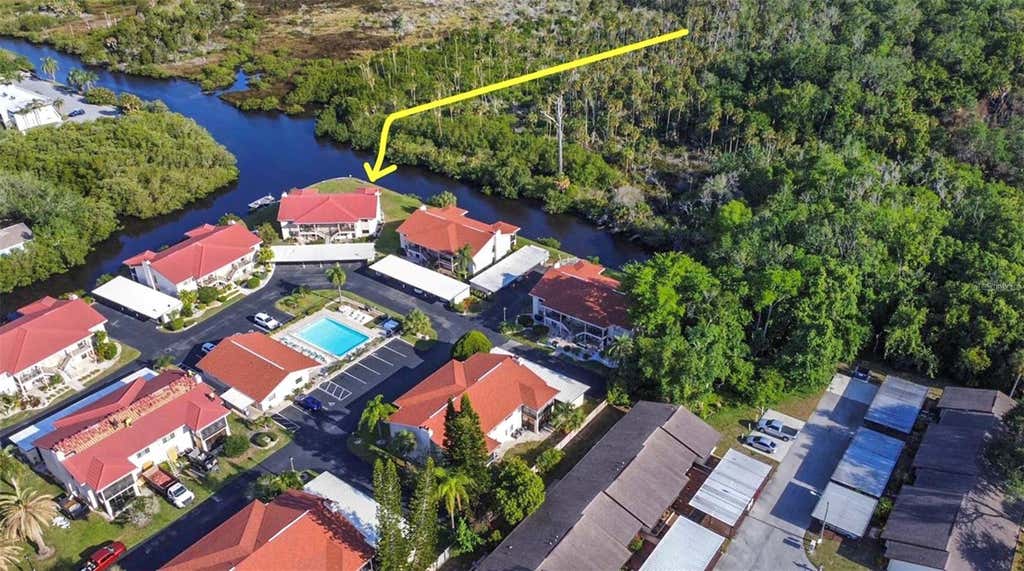 Photo of 9940 Eagles Point Circle #4, Port Richey, FL 34668 (MLS # TB8542510)