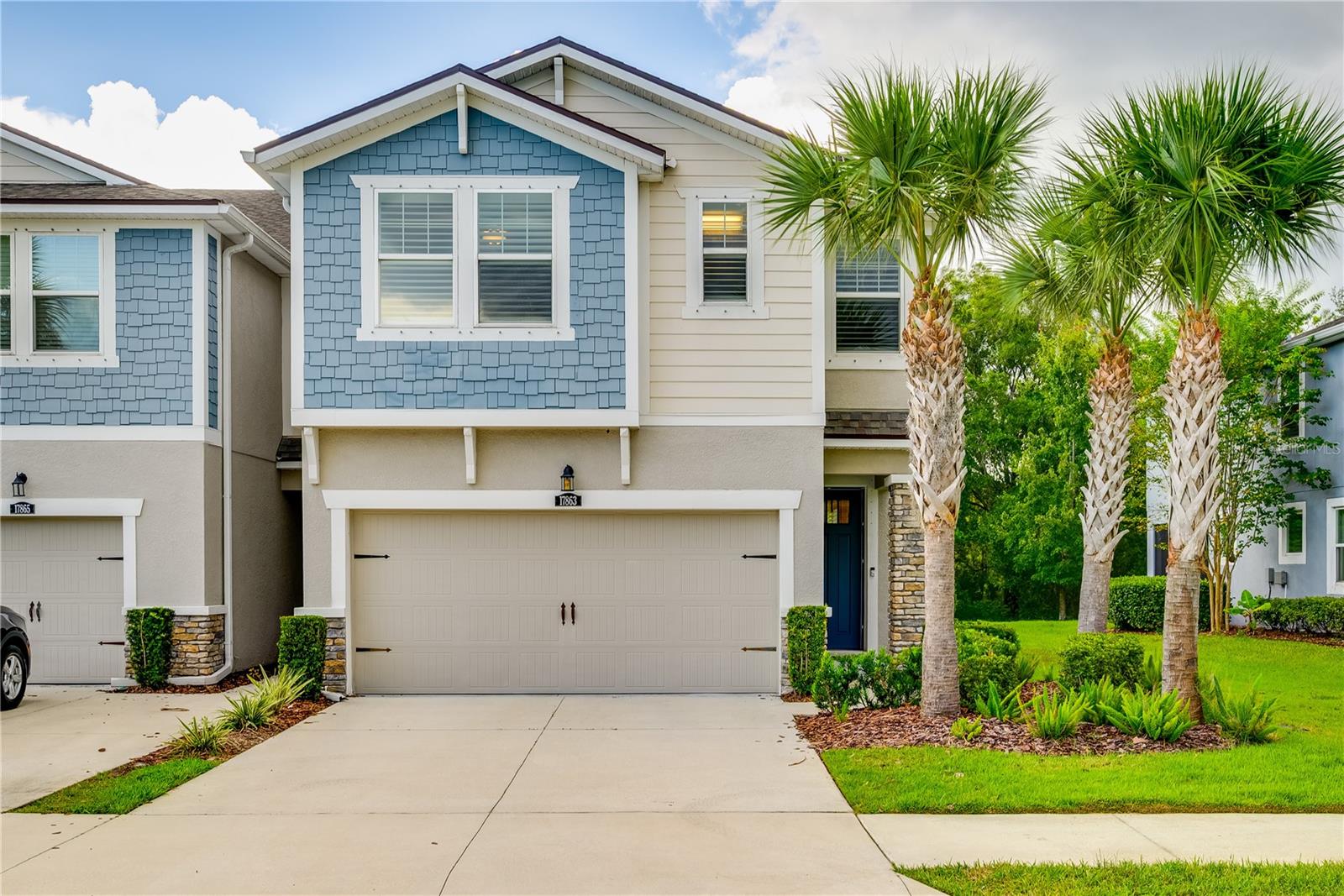 Welcome to this stunning 2,618 sq ft townhome in the highly sought-after and maintenance free gated neighborhood of LakeShore Preserve. Boasting 4 spacious bedrooms and 3 luxurious bathrooms, this home offers a perfect blend of style and comfort. The downstairs features elegant porcelain tile, granite countertops, and a custom backsplash in the kitchen with a walk in pantry. Throughout, you'll find premium plantation shutters and custom pavers on the screened-in lanai—ideal for outdoor relaxation. Upstairs, upgraded scratch-resistant laminate flooring enhances the spacious game and loft areas. The oversized laundry room with shaker cabinets provides ample storage. The master suite is a true retreat, complete with tray ceilings and an oasis bathroom featuring his-and-her sinks. The custom-built walk-in closet, with floor-to-ceiling shoe racks and extensive storage, is a dream for fashion lovers. Located directly across from the resort-style community pool, this home offers both convenience and luxury living at its finest. The home is ideally located between Dale Mabry and the Veterans allowing for easy access to anywhere in the Tampa Bay area.