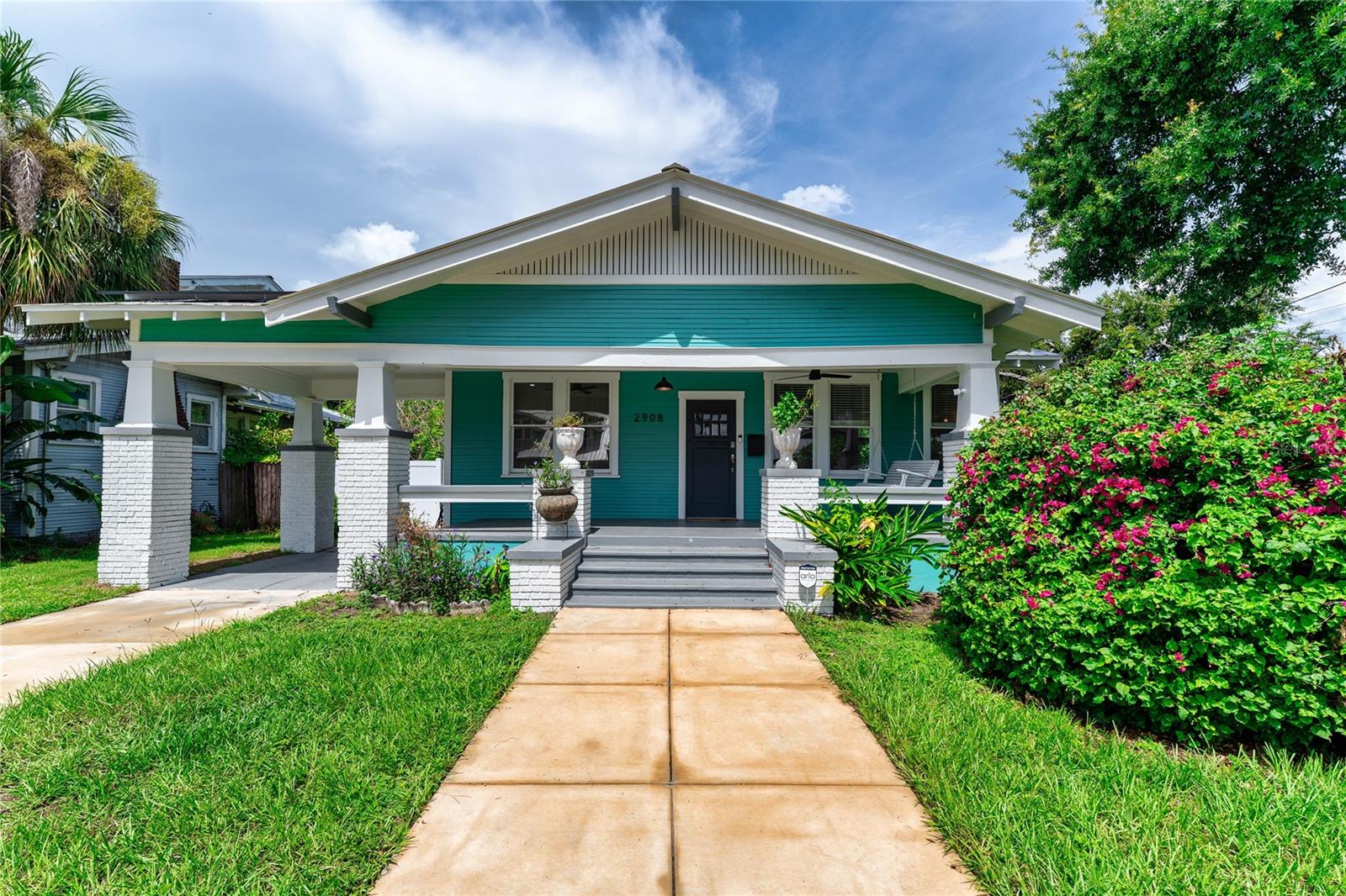Welcome to this beautifully maintained 3-bedroom, 2-bathroom Tampa Heights bungalow. From the moment you arrive, you’ll be charmed by the oversized front porch. Inside, original wood floors, built-ins, and abundant natural light add timeless character throughout the home. The main floor features two spacious bedrooms and a full bathroom, along with an oversized laundry room and ample storage. Upstairs, the entire top floor is dedicated to a private primary suite, offering a peaceful retreat with space to unwind.
Modern upgrades blend seamlessly with historic charm, including a brand-new deck, tankless gas water heater, and a car charging station under the covered carport. The home features solar panels with battery packs, providing energy efficiency and peace of mind during storms or outages.
A large storage shed and brand-new fencing complete the backyard, offering plenty of space for outdoor living and secure storage.
Don’t miss the opportunity to live in one of Tampa’s most sought-after neighborhoods, just minutes from Downtown, Armature Works, and the Riverwalk.