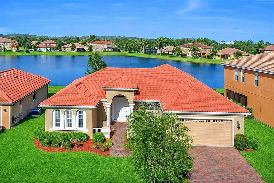 Welcome to this beautifully maintained 4-beds, 3 full baths home with lake views, located in the desirable gated community of North Shore Village in Kissimmee. Step inside to discover spacious living areas filled with natural light and designed for both everyday living and entertaining. The open-concept kitchen features ample cabinetry, generous counter space, and overlooks the living and dining areas with relaxing lake views from the backyard. The primary suite offers a private and relaxing retreat, while the additional bedrooms provide flexibility for family, guests, or a home office. With three full bathrooms, this home provides comfort and convenience. Enjoy peaceful mornings and beautiful sunsets from the backyard while taking in the serene lake view. Located within the gated community of North Shore Village, residents enjoy access to community amenities including a pool, while being conveniently located near shopping, dining, schools, airport and major highways. This beautiful home with lake views, solar panels, offers comfort, efficiency, and an excellent location. Schedule your private showing today.