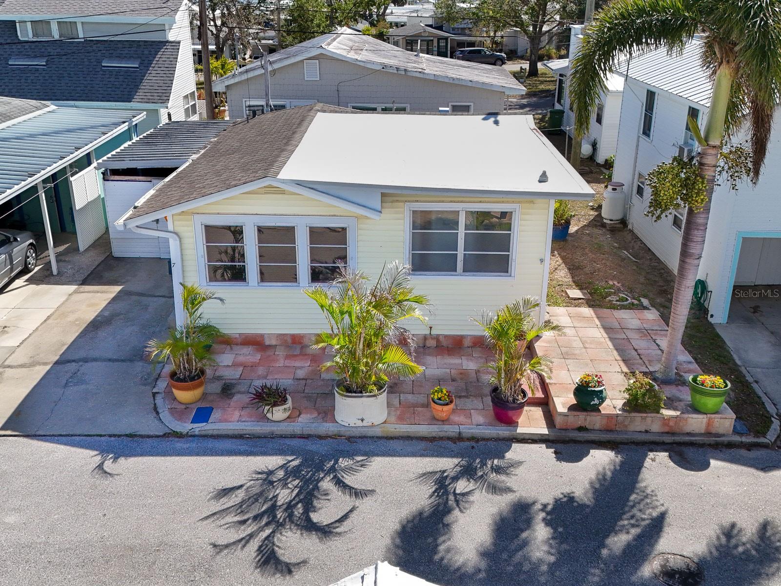 This Braden Castle Park 1925 cottage is the only home currently available that is NOT IN A FLOOD ZONE and had no water damage from last year’s storms. So, it is all ready for you to add your own personal touches and call it home, or your seasonal get-a-way. Nestled along the picturesque Manatee River, where it meets the Braden River, this one bedroom, 2 full bath, plus bonus room (small, but has a closet, window and the second full bathroom) offers a rare opportunity in a very special 55+ waterfront community. The one car garage has been used as a pottery/craft studio for several years; has electricity, water and an AC split unit. Untouched by the recent storms and not located in a flood zone, this cottage is situated in a neighborhood rich with history. Listed on the National Register of Historic Places, the community is home to charming, unique bungalows that showcase its distinctive character. Residents enjoy a dynamic waterfront lifestyle with direct Gulf access, a private boat ramp, a fishing pier dedicated to the neighborhood’s many Veterans;, boat slips, and an array of recreational amenities. The vibrant community center hosts various events and activities, fostering a warm and welcoming atmosphere. Enjoy coffee on the front patio while enjoying views of the river, fishing and boating a few doors down. In the evening, sit along the riverfront and enjoy your favorite book or social time with your neighbors. Braden Castle Park takes a step back in history and is truly an exceptional place to call home. Yet, you are close to shopping, beaches, a wide variety of restaurants, historic downtown Bradenton and RiverWalk. Truly the best of both worlds.
New roof: 2022, updated electrical: 2005