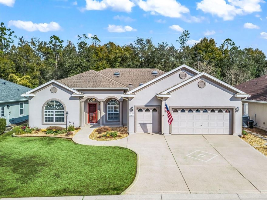 Stonecrest is a 55+ gated golf course community with all the amenities and 4 pools (one indoor), and just a Bridge Away By Golf Cart To The Villages! Exceptional 3/3 + Den Cedar model with a 2 Car + Golf Cart Garage, ROOF 2020, HVAC 2020, Soaring 10ft ceilings, Open and Split Floor Plan, and No Rear Neighbors! This home presents Tremendous Curb Appeal featuring Meticulously Maintained Professional Landscaping, Painted Concrete Driveway and Walkway, and an Elegant Front Porch! The Open Concept Floor Plan is Spacious, and Flooded with Natural Light, offering the Perfect Gathering space for family, and friends!  The Split Floor Plan provides maximum Privacy for both the Owners and their Guest, with the Primary suite commanding one side of the home while the guest bedrooms and guest bathrooms are located on the opposite side of the home. The Luxurious Primary suite offers a Huge Walk In Closet, and an En Suite bathroom. The En Suite Bathroom features a Double Sink Vanity, Bidet, Tiled Walk In Shower, and a Nice Size Soaking Tub! The two additional bedrooms feature nice size built in closets. Guest bedroom 2 offers an En suite bathroom with a Tiled Walk In Shower, and good size Vanity, providing your guests with Convenience, and Privacy! Guest bathroom 3 is conveniently situated next to the additional guest bedroom, providing ample space for your guests. The Impressive Gourmet Kitchen showcases Granite countertops, Tumble Tile Backsplash, Sold Wood Cabinets with Pullouts, Stainless Appliances, a Double Pantry Closet, Generous Breakfast Bar with Upgraded Pendant Light Fixtures, and Eat in Area with Access to the Enclosed Lanai. The kitchen flows seamlessly to the Living area, which offers an Exceptional Space for Enjoying Comfortable Living, and Entertaining! Gorgeous Laminate Flooring, and an Upgraded Light Fixture Adorn the Dining area accented by Plantation shutters, and opens to the Huge 16 x 18 Living area which offers access to the 24 x 10 Lanai!  Enjoy Exceptional Outdoor Living on the 23 x 20 Birdcage Enclosed Back Patio, with warm Tropical Breezes, Beautiful Sunsets, and Backyard BBQ's!  There is Plenty of Room for Storage in the 28 x 21 2 Car + Golf Cart Garage!  Call Cindy Now for Your Private Showing!   Stonecrest is a 55+ gated golf course community with all the amenities, pools, pickleball courts, softball, 18 hole championship golf course, Broad Stripes Golf & Social Club and over 80 different clubs to join! As a private gated golf course community, you can expect a high level of privacy and security. Overall, this home offers a combination of Tremendous Outdoor Space, Luxurious Features, a Fantastic Location, and a Secure Community Setting. A WONDERFUL LIFESTYLE AWAITS YOU IN STONECREST! Plenty of privacy, with No Rear Neighbors, and Privacy landscape, which provide a lovely park like setting for your backyard BBQ's !
