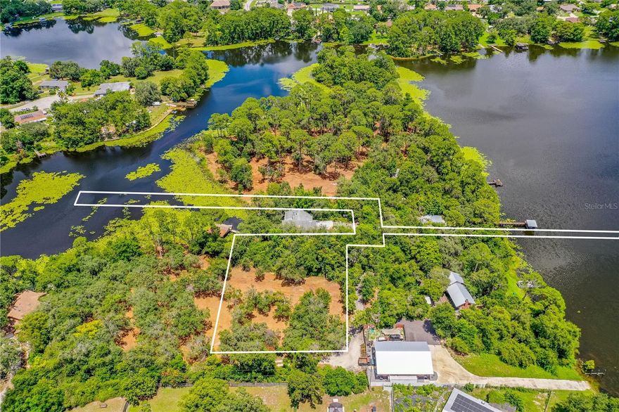 Nestled beneath a hammock of cascading Oak and Pine trees, this 1.62 acres of lakefront property offers the rare opportunity to create a dream oasis on a piece of pure Florida ground. With picturesque views of McGarity Lake, this is an outdoorsman's paradise to build a dream vacation or forever home. Situated at the end of a well-maintained dirt road with utilities nearby and water access to build a dock. Don't miss out on the chance to own a piece of old Florida! Adjoining parcels also available for sale.