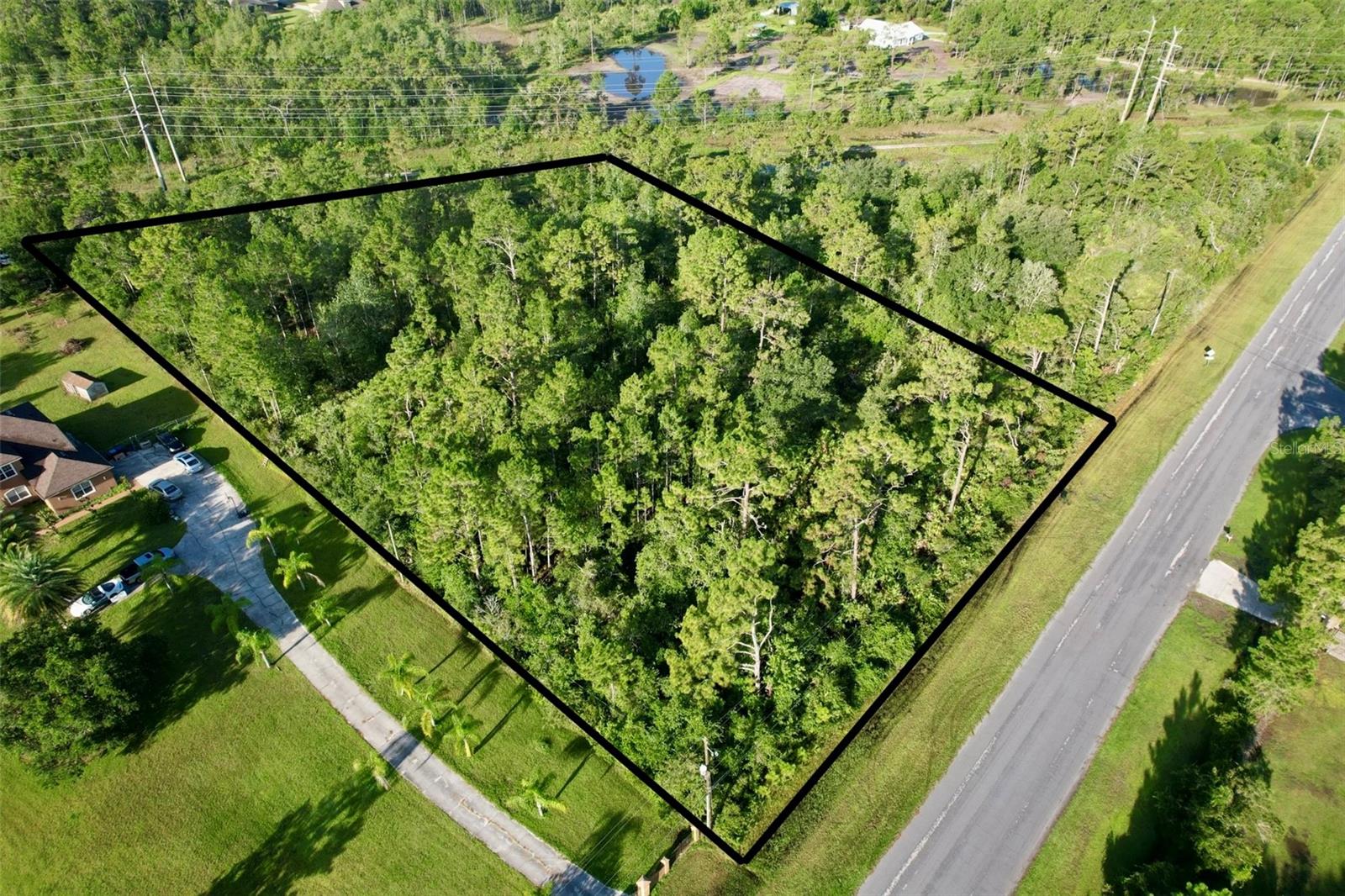 This spacious 1.95-acre lot on Oberly Parkway is located in the desirable Wedgefield community. Zoned R-1A for single-family homes, the property offers paved road frontage and a build-ready site ideal for a custom home. With no HOA and utilities nearby, this lot provides a peaceful country setting with easy access to SR 528, Orlando International Airport, Lake Nona, and the Space Coast. Whether building now or investing for the future, this lot presents excellent potential in a rapidly growing area.