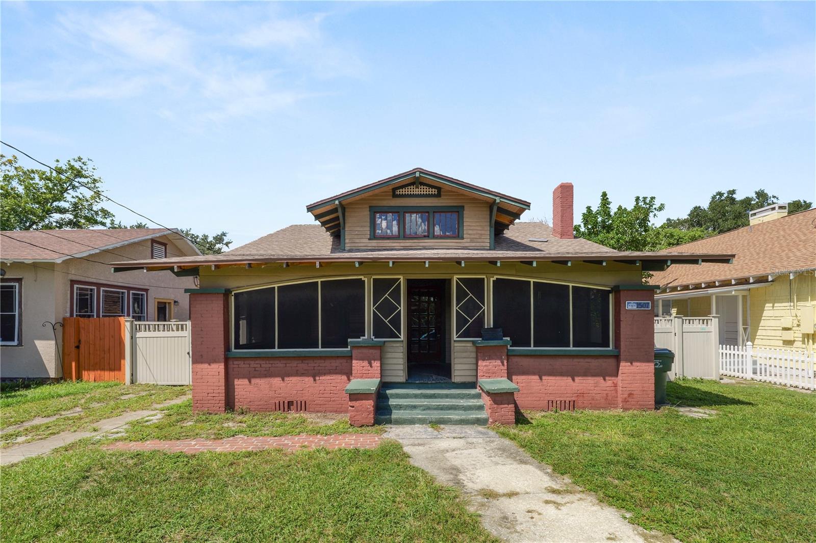 Timeless historic bungalow nestled in the heart of Lakeland’s charming Dixieland / Beacon Hills neighborhoods. This beautifully preserved home offers all the character of early 20th-century architecture with modern livability. Hardwood floors and original millwork greet you the moment you step inside, bathing the rooms in warm, natural light through abundant windows. A cozy screened-front porch invites leisurely mornings with fresh air, or evenings unwinding in peace—your private front-yard retreat. The kitchen is spacious and functional, with vintage appeal plus practical updates; adjacent laundry hookups add convenience.
Living spaces provide comfort and adaptability, whether you’re outfitting a home office, guest room, or creative space. A beautifully fenced backyard and patio offer outdoor living opportunities: grilling, gardening, entertaining—all in privacy. Just one block off South Florida Avenue, walking distance to Dixieland Historic shops and restaurants, and only mere blocks from Downtown Lakeland. Walk to cafés, shops, parks, lakes, and enjoy being part of a vibrant, historic community.