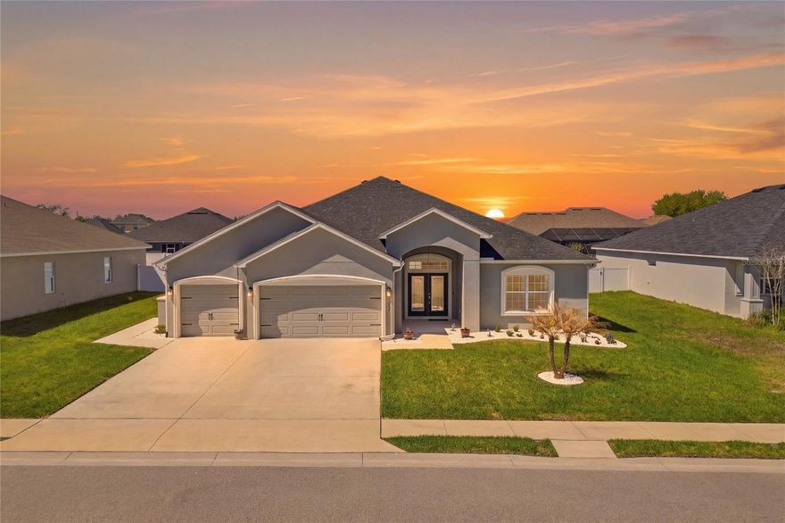 One or more photo(s) has been virtually staged. Welcome to this move-in ready home located in the gated Treymont community of South Lakeland. Built in 2022 by Highland Homes, this popular Willow II model offers over 2,600 square feet of beautifully designed living space with 5 bedrooms and 3 full bathrooms—perfect for a large family, guests, or flexible work-from-home living. Recent improvements include new light fixtures, a newly installed sidewalk, and refreshed landscaping that enhance the home's curb appeal.

Beautiful double leaded-glass entry doors open to a spacious foyer and inviting open-concept great room floor plan, ideal for entertaining and everyday living. The home features upgraded flooring and finishes throughout, offering a polished look far beyond builder-grade.

The oversized kitchen is truly the heart of the home, showcasing a massive butterfly island, granite countertops, stainless steel appliances, and gorgeous cabinetry with crown molding. Whether you love baking, hosting gatherings, or simply need space for busy family life, this kitchen delivers. A cozy café/breakfast area provides the perfect spot for casual dining, morning coffee, or your favorite espresso setup, while a formal dining space remains available just off the kitchen.

A versatile den area—currently set up as a home gym, could easily serve as a playroom, media room, or teen hangout space. The spacious primary suite comfortably accommodates a California king bed and additional furniture, and the en suite bath features a soaking tub, glass-enclosed tiled shower, dual granite vanities, a private water closet, and a large walk-in closet with additional linen storage.

Four additional bedrooms and two more full bathrooms provide excellent flexibility. Bedroom two is currently used as a “man cave” and would make a fantastic private office. Bedrooms three and four share convenient access to a hall bath, while bedroom five is privately located toward the rear of the home and is currently used as an in-law suite with easy access to the third bath and kitchen area.

Outdoor living is just as enjoyable, with a screened rear lanai featuring a large cooling fan and roll-down shades—perfect for grilling, relaxing, or gathering with friends and family. The vinyl-fenced backyard is pool-ready and offers plenty of room for pets, play, or future outdoor additions, with direct access to the third bathroom for added convenience.

Additional highlights include a three-car garage with pull-down ladder access to a partially floored attic for extra storage.

Ideally located just minutes from shopping, restaurants, medical offices, and the Polk Parkway, this beautiful home combines space, comfort, and convenience in one exceptional property.

Schedule your private showing today!