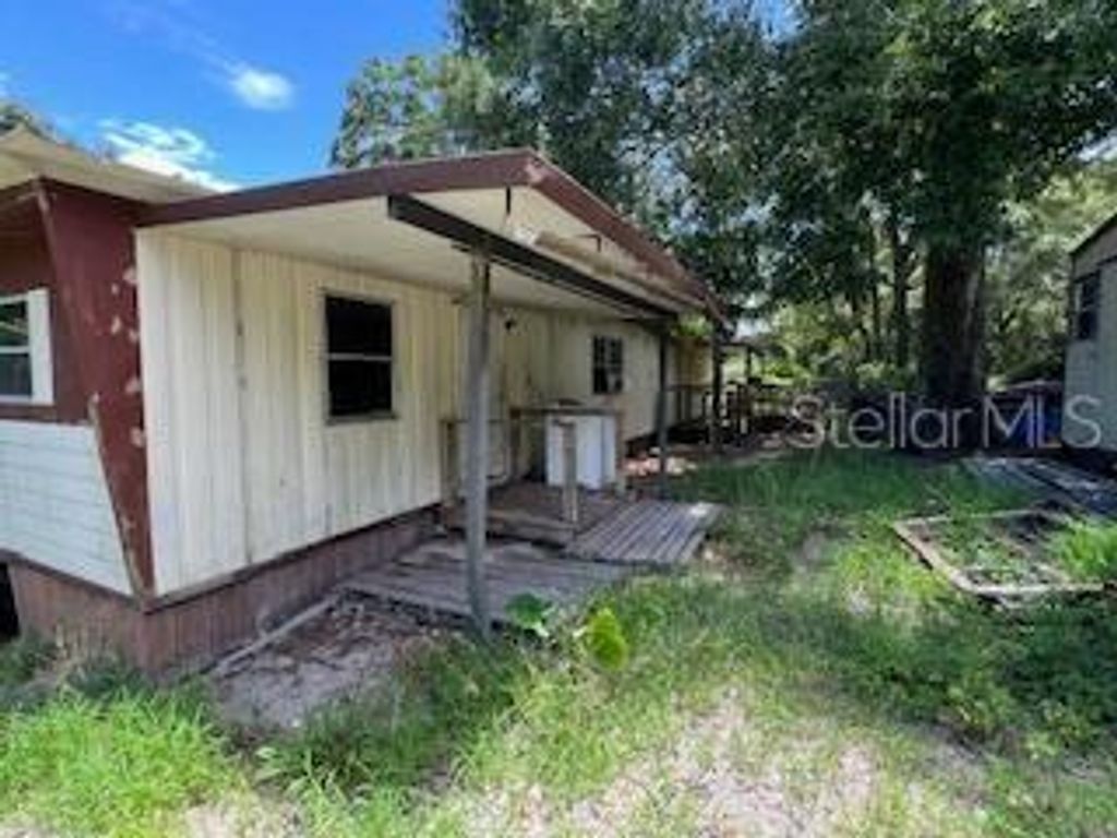 Photo of 207 Ridge Street, Pomona Park, FL 32181 (MLS # TB8404303)