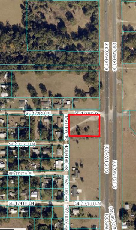 Commercial corner lot with median cut in fast growing area near The Villages. Located just a short distance North of Oxford Downs.