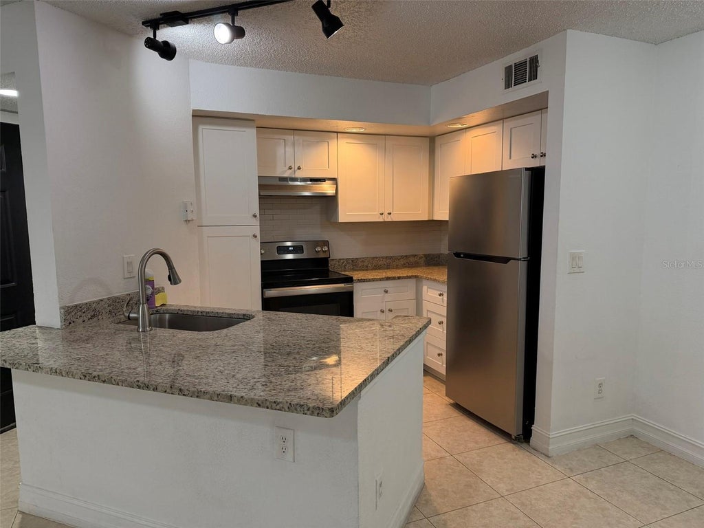 Photo of 4658 Commander Drive #813, Orlando, FL 32822 (MLS # O6432728)