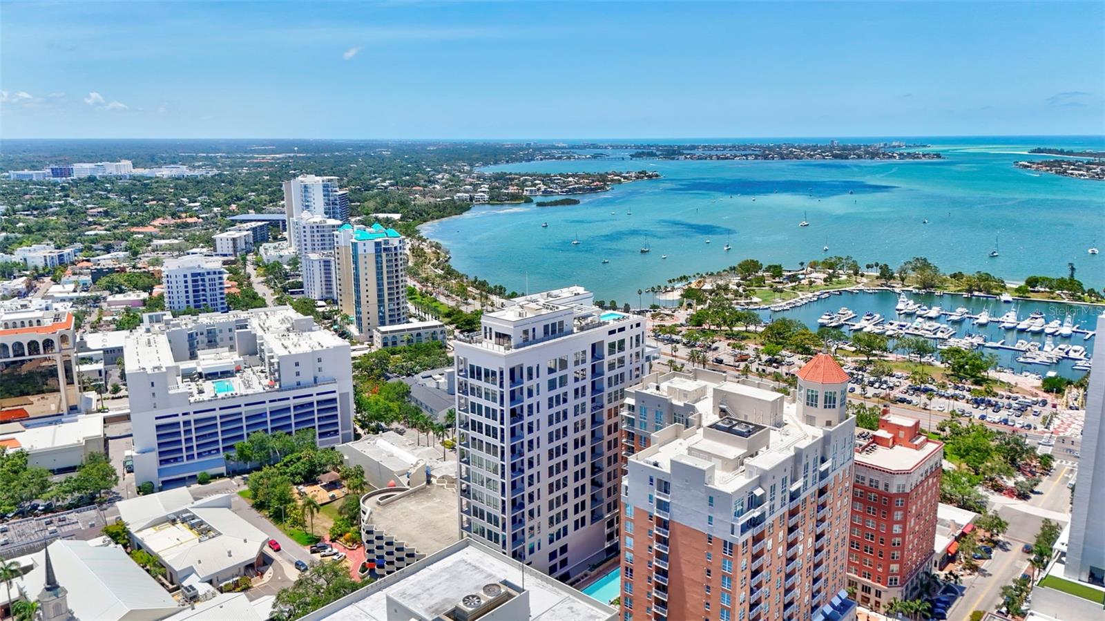 Experience elevated luxury at The DeMarcay in this brand-new, never-lived-in custom residence — a 3-bedroom, 3.5-bath sky home with a thoughtfully designed living space and breathtaking, unobstructed views of Sarasota Bay, the Gulf of Mexico, the Ringling Bridge, and Marina Jack's. From glowing sunrises to dazzling fireworks displays, your front-row seat to Sarasota’s skyline awaits.
The chef’s kitchen is a dream come true, featuring a 6-burner gas cooktop, top-of-the-line appliances, custom cabinetry, wine cooler, and a generous walk-in pantry. The expansive primary suite welcomes the morning light with serene water views and includes a spa-like bath with double vanities, a freestanding soaking tub, glass-enclosed shower, and large walk-in closet. Both secondary bedrooms offer luxurious en suite bathrooms for comfort and privacy.
No detail has been left untouched — this residence is fully outfitted with upgraded designer lighting, integrated audio, smart thermostat controls, and Lutron blackout curtains in every room. It truly lives like a single-family home in the sky.
Amenities are located on the 18th floor and feature a resort-style pool, grilling area, catering/hosting lounge, and a fully equipped fitness center — all with panoramic views. Additional conveniences include 24-hour resident services, two assigned garage parking spaces, and a private storage unit.
Set in the vibrant heart of downtown Sarasota, you’ll be just steps away from fine dining, boutique shopping, art galleries, theaters, and cultural attractions — all within easy walking distance.
This is luxury redefined. Come home to comfort, sophistication, and Sarasota’s most spectacular views.