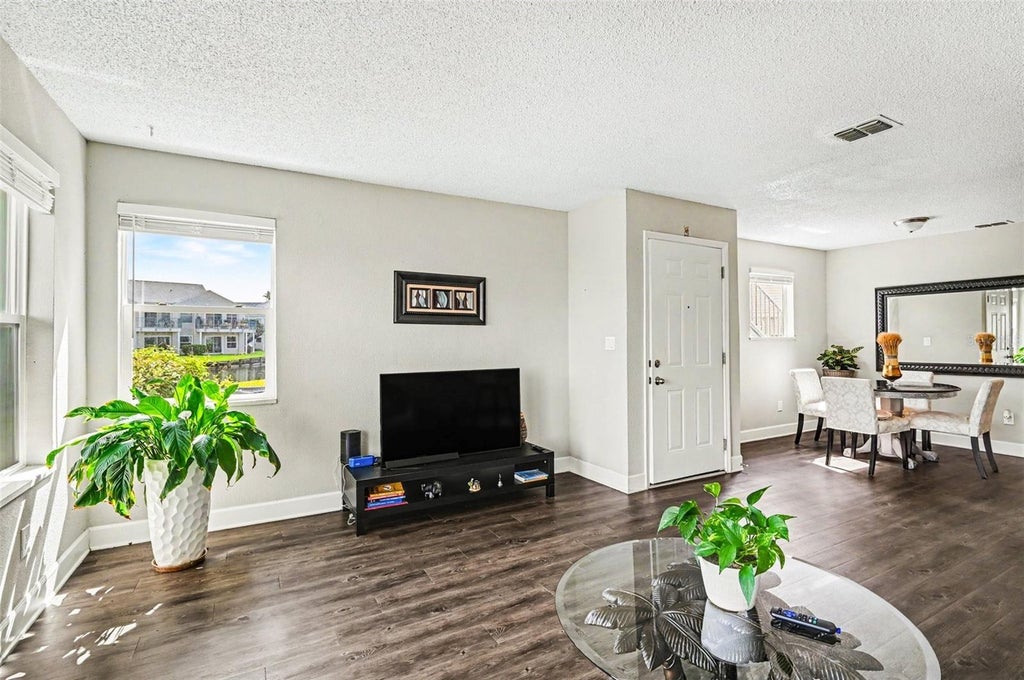 Photo of 2552 Woodgate Boulevard #107, Orlando, FL 32822 (MLS # O6416786)