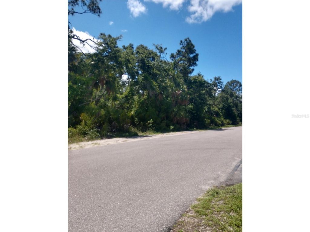 Photo of 1404 Kenesaw Street, Port Charlotte, FL 33948 (MLS # O6220009)