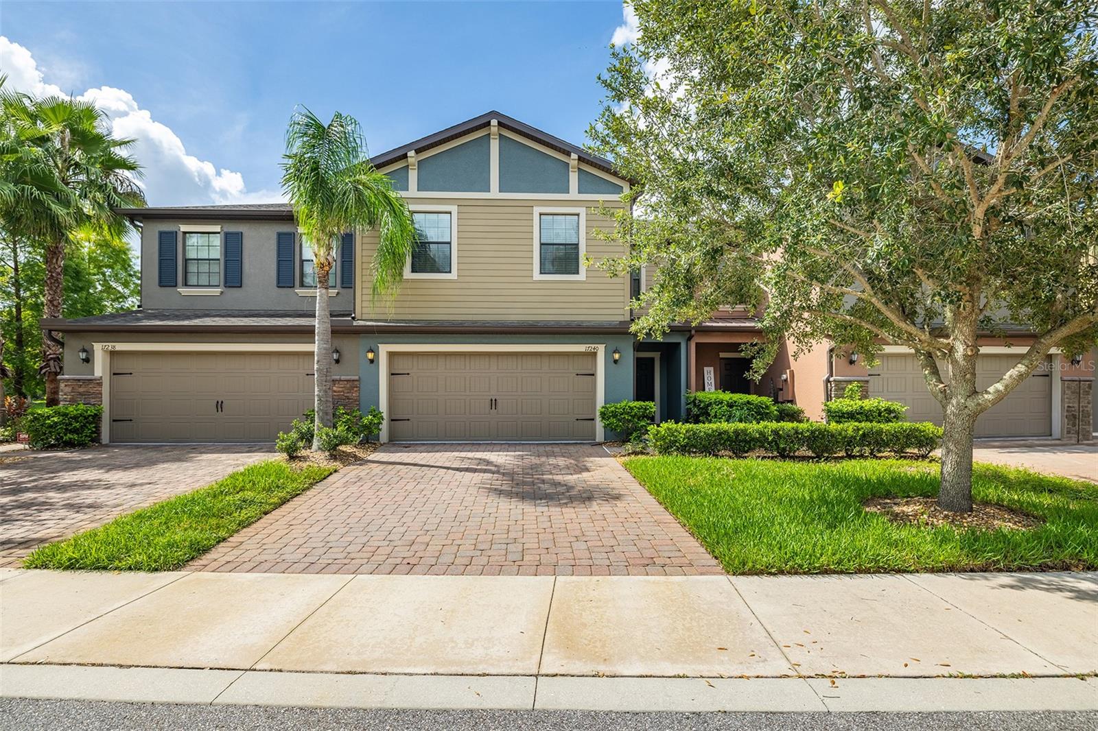 There's no place quite like this secluded , charming neighborhood in Lutz- tucked away yet perfectly located near everything you need, making this townhome a rare find. What truly sets this property apart is its exceptional peace and quiet. This serene, gated community is surrounded by mature landscaping and scenic waterfront views, offering comfort, privacy and tranquility in equal measure. This beautifully maintained 2-story townhome features 3 bedrooms, 2.5 baths, a spacious great room, a dedicated dining area and an upstairs loft all overlooking a pristine pond. From the paved driveway, step into a thoughtfully designed layout with an airy great room boasting soaring ceilings, custom diagonal tiles, designer lighting and window treatments. The dining area features a custom chandelier and sliding doors that lead to a screened lanai. The kitchen is standout, perfect for entertaining, with 42- inch staggered cabinets, granite counters, stainless steel appliances, pendant lighting over the island and a large pantry with plenty of storage. The master suite offers plush newer carpet, a designer ceiling fan, high ceilings, a spacious walk-in closet, bath with granite counters, dual vanities, a garden tub and separate shower. The upstairs loft is ideal for and office, den or playroom, while the secondary bedrooms are generously sized with newer carpet and custom touches. The laundry room is conveniently located upstairs. Enjoy peaceful water views from the screened, covered lanai- an ideal space to relax in total quiet. Additional features include a split bedroom plan, hurricane shutters, neutral tones throughout, a 2-car garage with automatic opener and a move-in ready interior. Located close to the Veteran's Expressway, St. Joseph's Hospital, nearby shopping, Tampa International Airport, top rated Tampa schools, dining and beaches. This home perfectly blends a prime location with peacefully living. Immaculately maintained and move-in ready, it's a rare find you won't want to miss.