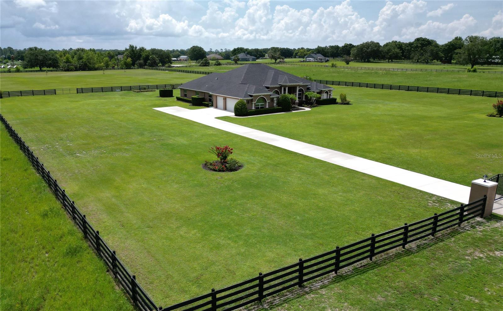 Luxury, Privacy, and Modern Comfort on 5+ Acres
Welcome to this exquisite custom built estate, offering the perfect blend of upscale living and country charm. Built in 2019 and thoughtfully designed for both comfort and function, this 4-bedroom, 3-bath residence boasts over 3,500 square feet of light-filled living space, nestled on 5.12 fully fenced, horse-ready acres.
From the moment you enter, you’ll notice the expansive open layout, soaring 10-foot ceilings, and elegant finishes throughout. The heart of the home is the spacious central kitchen—perfectly positioned for entertaining with easy flow into the living and dining areas. Retreat to the luxurious owner’s suite featuring a spa-style bath, an oversized walk-in closet, and private access to the pool lanai .
Property Highlights:Screen-enclosed pool with brand-new screens (2024) for year-round outdoor living.Whole-Home Audio System, Oversized 3-car garage with room for vehicles, tools, and recreational gear. 80-gallon water heater and whole-home water softener system. Over 250 ft deep well—ideal for future barns, gardens, or outbuildings. Double no-climb fencing and electric access gate (solar-powered) for added security and ease. 8-camera security system. Fully lit attic providing additional storage space Zoned for horses – create a hobby farm, workshop, or equestrian retreat
Tucked away on a peaceful country road, yet just minutes to downtown Tavares, historic Mount Dora, and the Harris Chain of Lakes—this property offers unmatched privacy without sacrificing proximity to shopping, dining, and recreation.
Whether you're dreaming of a luxurious homestead, a private retreat, or space to live, work, and play—this one-of-a-kind property delivers.