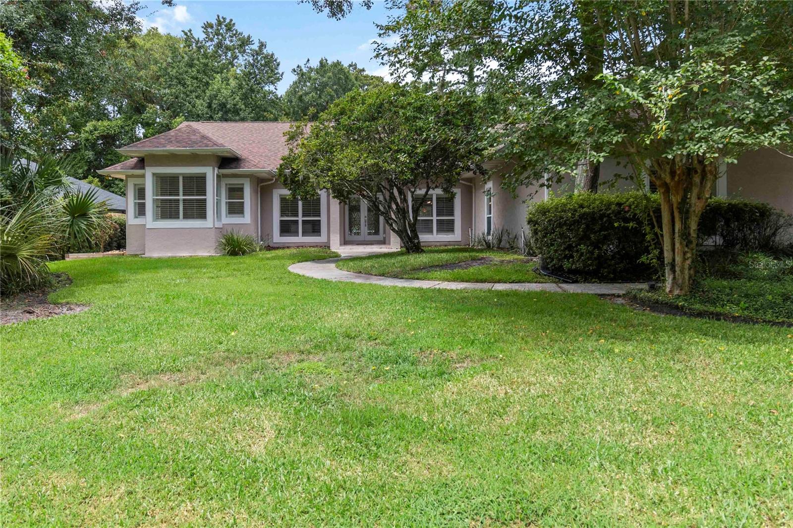 One or more photo(s) has been virtually staged. POOL HOME in THE SPRINGS! This 3 bedroom (+home office), 3 bathroom, 3-car garage home is set on a spacious lot measuring slightly over half an acre that backs up to woods. No rear neighbors unless you count the deer this community is well known for. Multiple areas in this home face the pool, woods and the Florida sun that sets over it all. The bedrooms are organized in a split plan arrangement, and 3,360 heated square feet ensure spacious living areas throughout. The primary suite has 2 closets & its own private bathroom with soaking tub and separate shower w/sauna feature, the secondary bedrooms both have walk-in closets & share a “jack & jill” bathroom, and the 3rd bathroom has a pool exit to help wet feet stay out of the main living spaces. This home has formal living & dining rooms, gourmet kitchen with breakfast bar & dinette area, and a spacious family room with fireplace & wet bar. The bedroom and hall closets have custom built-ins, the side-loading garage has a closet & workshop area w/ ceiling fan, and there is attic space with shelving for organized storage. Bonus points for a long extended driveway for plenty of parking! The Springs is tucked away off of SR-434, allowing convenient access to shopping & restaurants, along with Wekiwa Springs State Park approximately 4 miles away. The Springs community is a 400 acre dedicated wildlife sanctuary boasting a beautiful natural spring which provides community swimming and events all year long. Homeowners have a variety of community amenities, such as guard gated entry, community pool & clubhouse, playground, tennis courts, natural spring/beach area, tree-lined streets with paved trails, horse stables and more! Enjoy convenient living while fulfilling all your cravings for wildlife and nature.