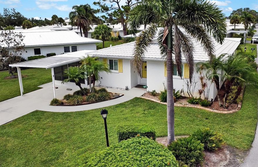 BRING YOUR BOAT! This rare and highly sought-after stand-alone villa—just ½ mile from the powdery sands of Nokomis Beach—comes with a DEEDED BOAT SLIP along the canal-side seawall, lift-ready and suitable for up to a 20-ft boat, complete with water and electricity at the slip, offering direct access to the Gulf for unforgettable sunset cruises, dolphin sightings, and weekend adventures. Located on a desirable corner lot in the vibrant, pet-friendly waterfront community of Fairwinds Village, this beautifully updated 2-bedroom, 2-bath home features a light-filled, open-concept layout with sleek 18"x18" ceramic tile throughout, Plastpro hurricane-impact windows, doors, and French doors that provide exceptional insulation—so well sealed, you won’t hear a sound from outside, wood blinds, and a stylish designer kitchen with quartzite countertops, brand-new stainless LG appliances, Bosch dishwasher, and under-cabinet lighting. The primary bedroom has 3 separate closets and a large en-suite bathroom.  The guest bedroom includes an en-suite option, with a pocket door that can be closed to create a private guest suite—ideal for visitors or multigenerational living. Both bathrooms have been tastefully updated with modern vanities, and the home offers a variety of inviting indoor-outdoor living spaces, including a charming 3-season front porch with new epoxy flooring, an enclosed sunroom, and a private rear patio with freshly painted concrete and a remote-controlled retractable awning. Additional highlights include a durable metal barrel tile roof, privately owned irrigation system that runs off the community well, new HVAC system (2024), whole-house re-pipe (2023), and a tankless water heater (2020), ensuring comfort and peace of mind. Fairwinds Village residents enjoy resort-style amenities such as a heated pool, clubhouse, dog park, kayak launch and storage, pickleball, bocce ball, shuffleboard, and lush green spaces with tranquil canal views. Whether you’re walking, biking, or taking a golf cart to dinner, shopping, or grabbing a scoop at the local ice cream shop—or simply taking a peaceful stroll to the beach to catch a breathtaking Gulf Coast sunset—this home is more than just a place to live—it delivers the ultimate Florida lifestyle. Move right in and start living your coastal dream!