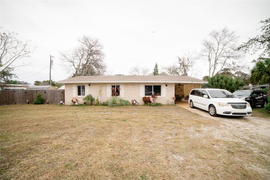Welcome to this well-maintained 3-bedroom, 2-bath concrete block home in an established Daytona Beach neighborhood. Featuring an open-concept layout with tile flooring throughout the main living areas, this home offers a bright and functional space ideal for everyday living.

The updated kitchen includes wood cabinetry, granite countertops, a center island with bar seating, modern lighting, and a full appliance package, seamlessly flowing into the dining and living areas. The bedrooms are comfortably sized with ceiling fans and ample closet space, while both bathrooms are clean and updated.

Enjoy a fully fenced backyard with paver patio areas, multiple storage sheds, and space to relax or entertain. Pride of ownership is evident throughout. Conveniently located near shopping, dining, schools, and major roadways.