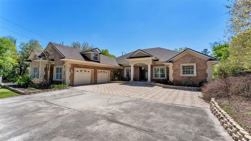 One or more photo(s) has been virtually staged. Experience the perfect blend of elegance and tranquility in this exquisite custom-built 4-bedroom, 3-bathroom home plus office and heated saltwater pool, situated on over 5 acres with no HOA. Nestled in a peaceful country setting, this residence offers privacy and space while still being conveniently close to restaurants, shops, and I-4 for easy access to Tampa and Orlando. Step inside to discover soaring high ceilings and meticulous attention to detail throughout. The inviting living room boasts beautiful views and direct access to a spacious screened-in patio overlooking the heated inground saltwater pool and spa – recently resurfaced in 2023 for your enjoyment year-round. The primary suite is a true retreat featuring tray ceilings, a versatile flex space with built-in bookshelves, and a luxurious ensuite bathroom with dual vanities, a garden tub, a tiled walk-in shower, and a large walk-in closet. The office, located at the home’s entry, is well-appointed with built-in cabinetry and a desk—perfect for remote work or study. The guest bathroom known as the pool bathroom offers a walk-in shower and access to the pool. The remodeled kitchen (2024) is a chef’s dream with stone countertops, stainless steel appliances, a convenient touchless faucet, ample cabinetry and counter space, plus a built-in kegerator. Adjacent is a cozy family room with coffered ceilings—ideal as a secondary living area or game room. Two bedrooms share a beautifully updated bathroom complete with dual sinks and a walk-in shower. The fourth bedroom is located upstairs, providing additional privacy. Enjoy outdoor living to the fullest with the oversized patio featuring a built-in outdoor kitchen and an outdoor shower. A separate fenced area is perfect for small pets, while recent upgrades include a new roof (2025), a new septic pump (2026), and an extended driveway providing plenty of parking for vehicles and toys. This exceptional home delivers luxury, convenience, and country charm all in one incredible package. Don’t miss your chance to make it yours!