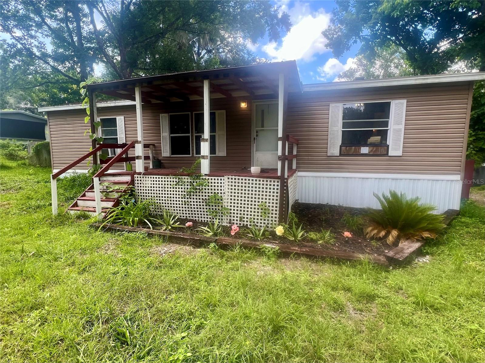 Welcome home to this well-maintained 3-bedroom, 2-bath mobile home nestled on a spacious and buildable .69-acre lot. This property offers the perfect blend of comfort, functionality, and future potential. Inside, you'll find a bright and open floor plan featuring a spacious living room, an eat-in kitchen ideal for family meals or entertaining, and a generous main bedroom complete with a large en-suite bathroom and walk-in closet. Each room is thoughtfully designed to maximize space and comfort. Step outside to enjoy the very large backyard, offering endless possibilities for outdoor living — from barbecues and gatherings to gardening or even future expansion. Whether you're looking for a move-in-ready home with room to grow or a property with development potential, this one is a must-see!