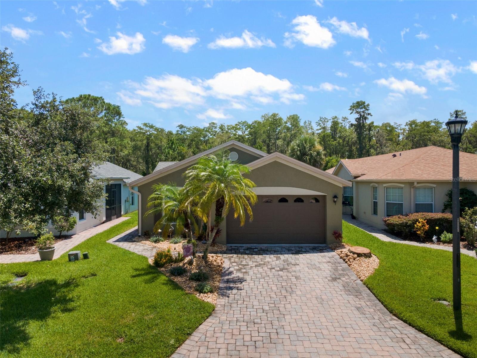 Welcome home to this *MOVE-IN READY* property featuring 2 Bedrooms PLUS Den, 2 bathrooms and a *PRIVATE WATER VIEW & TREE VIEW* in the gorgeous gated 55+ community of Solivita! This home truly shows like a MODEL! **Please Note: This home can be sold COMPLETELY FURNISHED/TURNKEY AND WITH GOLF CART – Outside of Contract**. This home is also FULL SOLAR! Enjoy $33 a month electric bills! Also the CDD DEBT Portion is PAID OFF. As you walk up the driveway and enjoy the beautiful luxurious landscaping as you enter the front door. Fall in love with the completely PRIVATE WATER & CONSERVATION VIEW while relaxing on your New Extended Lanai (2020) with Motorized Shade/Awning! All windows are DOUBLE PANE, LOW-E, Hurricane Proof Windows! (2021) The backyard is completely private, where you can watch the birds, trees, and enjoy the Florida breeze. This spacious open floorplan features VAULTED CEILINGS in the Large Living Room and Dining Room. The kitchen is large with Stainless Steel Appliances, Beautiful Cabinetry and space for a Dinette Area with windows for plenty of natural light. This home is a split bedroom concept that creates the ideal environment for guests. The Primary Bedroom offers a Large En-Suite Bathroom with a COMPLETELY REMODELED Master Shower, plenty of Counter Space, Linen Closet and Walk-in Closet. And the best part is your PRIVATE VIEWS as you sit on the Large Covered, Screened-in Lanai. Extra Upgrades include: AC (2022), Double Pane Windows (2021), Entire Home WATER FILTRATION SYSTEM, Laminate Floors throughout Living areas, New Farm Sink, Stainless Steel Appliances, Plantation Shutters Throughout, Completely Renovated Master Shower, and New Extended Lanai (2020). Does it get any better than this? Solivita offers endless amenities including 14 heated swimming pools, indoor pool and indoor walking track, state of the art fitness centers, pickleball courts, lighted tennis courts, golf, over 250+ clubs to join, 3 community restaurants, Farmers Markets every Monday and Friday, and so much more! Only 30 minutes from Disney and all of Orlando’s major attractions! Publix, Aldi’s & Super Walmart are also just a few miles outside the Main Gate! Convenient to shopping and major roadways. Poinciana Lakes Plaza is a MAJOR NEW SHOPPING CENTER that opened directly across from the Solivita Main Gate! This AMAZING new shopping center features so many restaurants and shopping including: Sprouts Grocery, Ross, TJ MAXX, ULTA Beauty, Hair Cuttery, Burlington, Rack Room Shoes, PETCO, Outback, 5 Guys, First Watch, Urgent Care, Dentist, TD Bank – AND SO MUCH MORE TO COME! Call today to schedule your private showing!