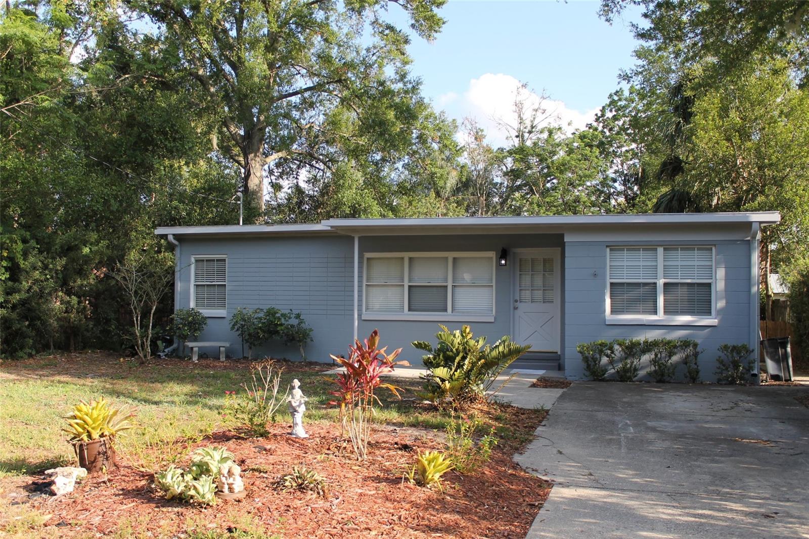 Adorable mid century modern bungalow in Winter Park! This 3 bedroom, 1 bathroom home has been beautifully updated with new tile wood floors in the main living area. The kitchen features white appliances and tasteful white cabinetry. The updated bathroom features a new vanity and classic mosaic tile floor. Enjoy the spacious backyard with wooden deck! Washer, dryer and lawn care is included! This property is available July 15, 2023.