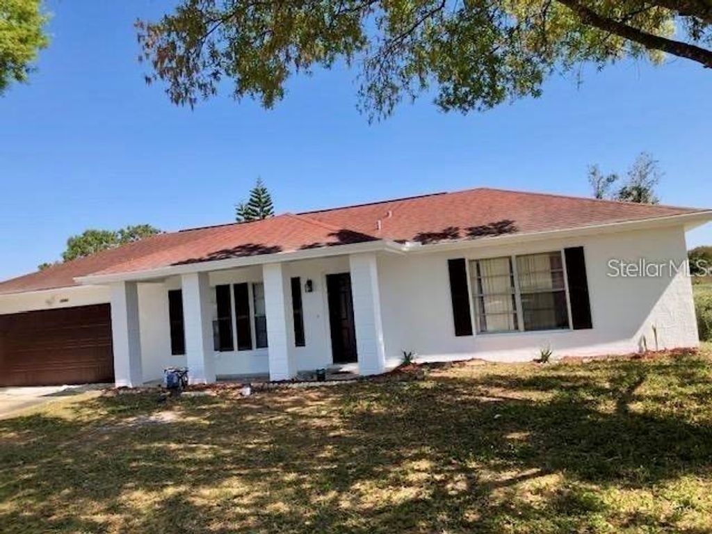 Photo of 12643 Idaho Woods Lane, Orlando, FL 32824 (MLS # O6396326)