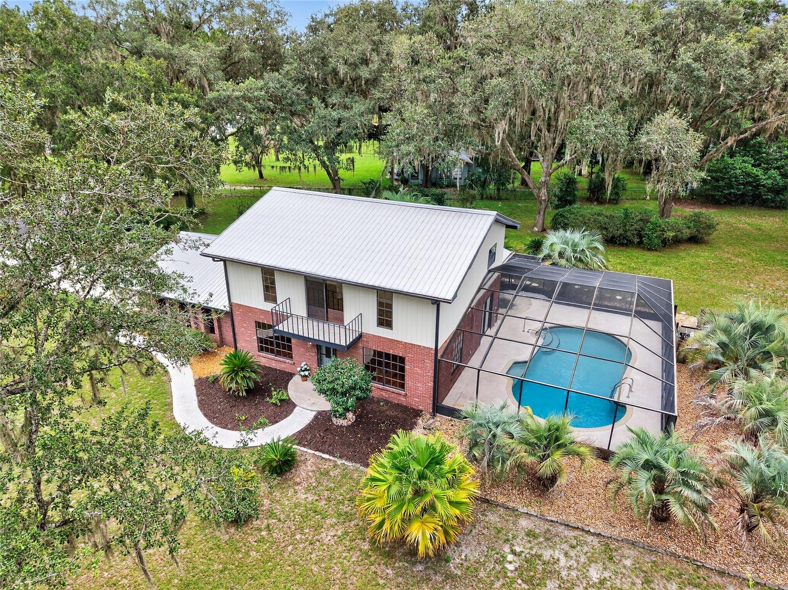 Live where boating, fishing & river adventures are right around the corner! Welcome to this adorable 3/2/2 POOL HOME nestled in the River Gardens subdivision of Dunnellon, Florida. With its classic brick exterior and a two-story design, this home exudes Florida's timeless charm. Step inside to discover a spacious layout with recently updated flooring throughout much of the home, along with the peace of mind that comes with a newer HVAC system installed in 2024 and a durable metal roof installed in 2014. The property sits on a generous 0.78-acre lot, providing ample outdoor space for gardening, entertaining, or simply taking in Florida’s natural beauty. Out back, a screened-in pool provides the perfect private oasis for sunny afternoons and weekend gatherings. And when you’re ready for adventure, the Goldendale Boat Ramp is just minutes away, granting you easy access to boating, fishing, and water sports on the Withlacoochee River and nearby Lake Rousseau. This is an ideal location, as it is also only 10 minutes to the famous Rainbow River and Historic downtown Dunnellon, about 30 minutes to Crystal River or Ocala, and between 1–1.5 hours to Gainesville, Tampa, or Orlando airports, theme parks, and more. Whether you’re seeking a primary residence, a vacation retreat, or an investment opportunity, this River Gardens gem offers the perfect blend of comfort, convenience, and lifestyle.