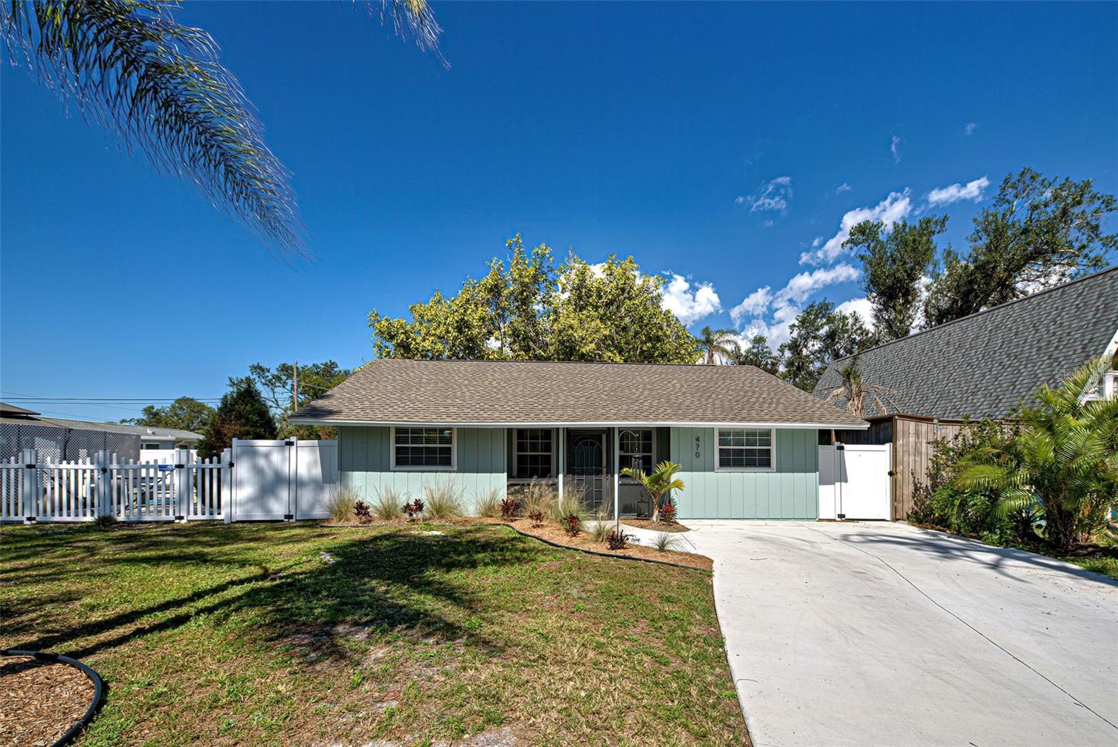BUY THIS ADORABLE HOME FOR AS LOW AS 4.690% INTEREST RATE (based on current rates). SELLER IS OFFERING A 2-1 BUY DOWN!! DON'T MISS THIS AMAZING OPPORTUNITY! You absolutely must see this adorable property! Charming cottage style 3-bedroom home with more space than you can imagine. Don’t let the square footage deter you. This gem offers an ample living room, cozy kitchen and dining area, 3 full bedrooms, 2 bathrooms, a mud room, and not one but two bonus rooms! A spacious covered screened lanai overlooks a huge privately fenced back yard with ample room for a pool. Enter through a cozy screened front porch to the living room with two windows flooding the area with natural light. An open concept floor plan provides dining adjacent to the kitchen. The kitchen features raised panel cabinets, granite countertops, new stainless appliances, and faucet. Enter the first bonus room through charming French doors and let your imagination roam to the multitude of uses for this space. The primary bedroom boasts new carpet, sliding glass doors leading to the screened lanai and French doors leading to the bonus room. The main bath has been updated with a new vanity, mirror, commode, faucet, shower head, resurfaced shower tile and luxury vinyl flooring. The guest bath has a new shower, vanity, commode, and flooring. The second bonus room situated at the back of the house provides privacy, perfect for a home office, fitness room or playroom and features new luxury vinyl flooring. A large laundry closet leads you to the mud room where you’ll find plenty of additional space for storage. The third bedroom has a walk-in closet and new LV flooring as well. In addition to everything this home also offers a new roof in 2023, new AC in 2018 with all new ductwork replaced in 2024, new insulation in the attic, new concrete driveway, new exterior, and interior paint. Perfectly located just minutes to Dearborn St. with its charming ambiance, quaint shops, and dining venues. Close to beaches and shopping. You’ll love to call this your new home! PRICED TO SELL, REDUCED OVER $17,000!!