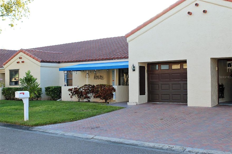 Located in the Maitland of Tamarac by the Gulf - a premier 55+ golf cart, friendly community. Not in a flood zone *No flood insurance required*. Easy travel to airports: Tampa International Airport 20 minutes, Clearwater/St. Petersburg Airport only 12 minutes, Sarasota/Bradenton Airport 50 minutes. This home is beautifully maintained that will give you comfort and convenience.  The HOA covers water, internet, cable, trash, the roof, and ground maintenance in the monthly fee leaving you free to enjoy the benefits of stress free and maintenance free living in this golf course community. Only utility bill is electricity. Golf carts permitted, take it to your heated community pool, and clubhouse. Just minutes to the Gulf beaches, dining, entertainment and shopping. Drink your morning coffee and relax in the afternoon with a beverage of your choice on your front porch.  Inside the Villa offers two bedrooms and two bathrooms. The living room is nice size great room that offers you plenty of space to entertain between the two rooms.  The kitchen has a pass-through to the dining area, which makes it easier to prepare meals.  The seller has already purchased hurricane shutters for all the windows, giving you peace of mind during hurricane season.