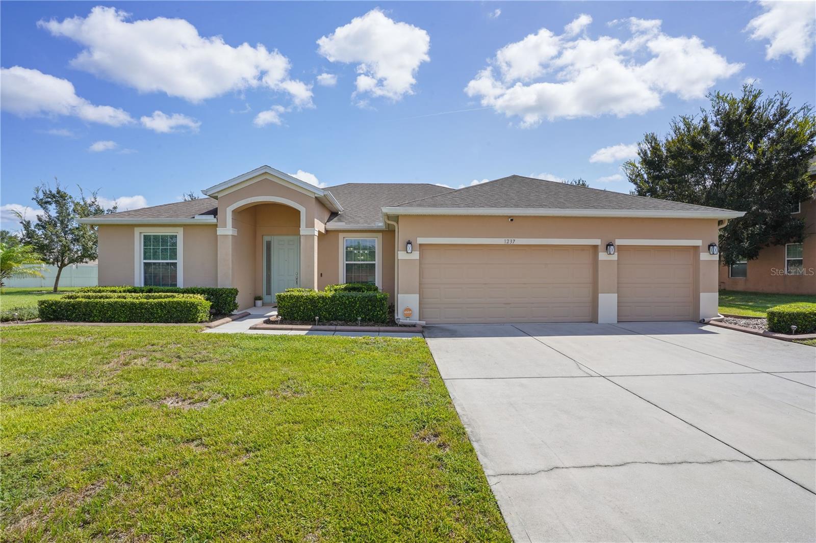 Welcome to 1237 Legg Drive, nestled in the highly desirable Rock Springs neighborhood of Apopka, FL! This inviting 4-bedroom, 2-bathroom 3-car garage, pool home features a thoughtful split bedroom layout and is perfectly situated on a peaceful cul-de-sac, offering the ideal blend of privacy and convenience. Set on a generous .29-acre lot, you'll love the private pool and spacious backyard—perfect for entertaining, relaxing, or enjoying Florida sunshine.
Inside, you'll find large ceramic tile throughout the main living areas and engineered hardwood flooring in all bedrooms, creating a clean and cohesive design. A dedicated living room and dining room provide formal spaces, while the large family room is ideal for casual gatherings.
The primary bedroom is a true retreat with tray ceilings, private pool access, his and her closets, and a spa-like ensuite bathroom featuring dual vanities, a walk-in shower, and a garden tub. The three additional bedrooms are spacious and versatile—perfect for guests, a home office, or playroom. The guest bathroom also includes dual sinks, ideal for busy households.
At the heart of the home is the open-concept kitchen, complete with granite countertops, stainless steel appliances, a dedicated pantry, and plenty of counter space—perfect for cooking, hosting, and everyday living. The kitchen flows seamlessly into the main living areas, keeping everyone connected.
Additional highlights include ample storage and a large backyard with endless possibilities. Located just minutes from shopping, dining, schools, parks, and major highways, this home combines everyday comfort with an unbeatable location.
Don’t miss your chance to call this Apopka gem your own.