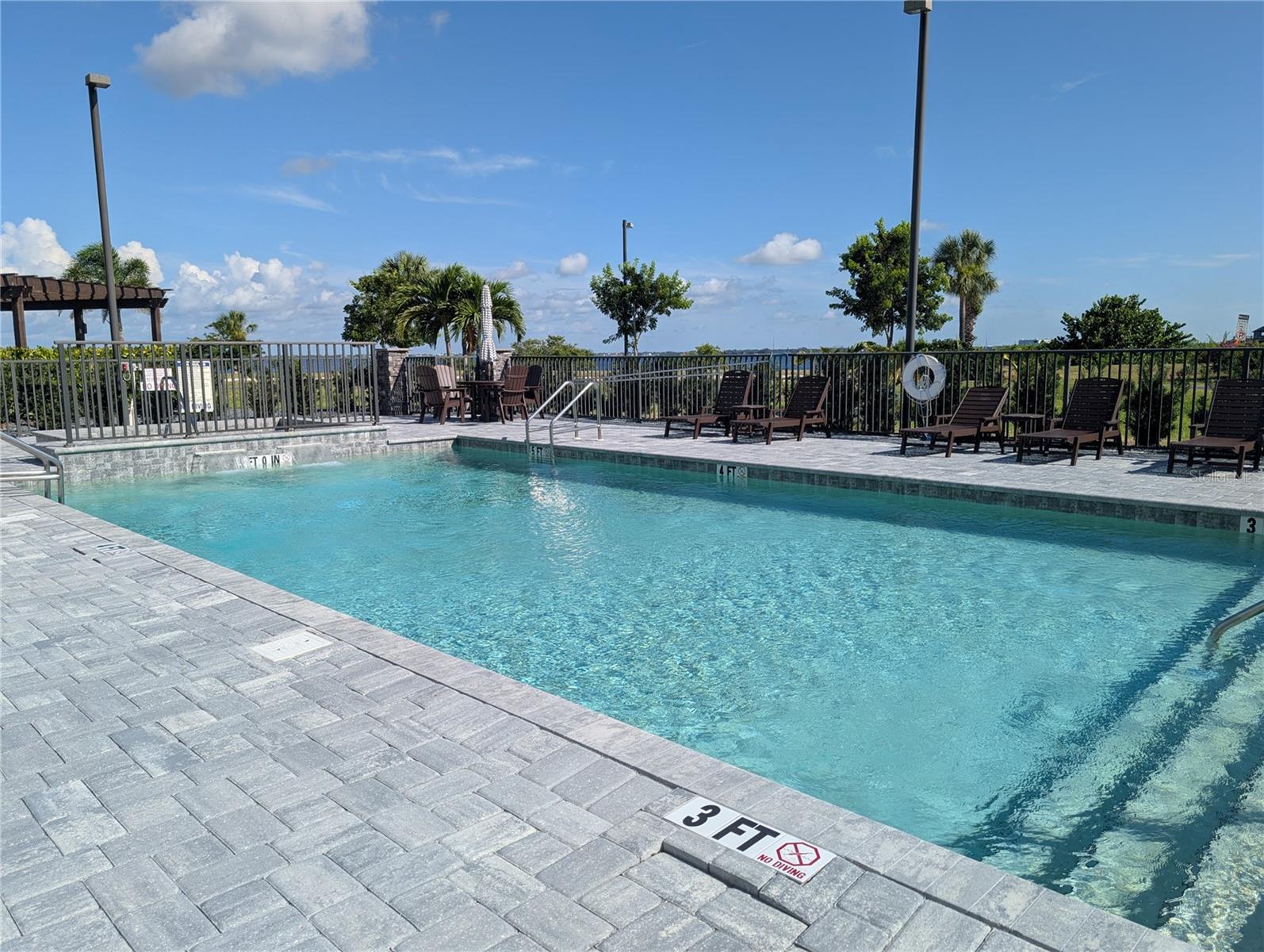 Experience breathtaking views of Charlotte Harbor from this fully furnished 2 bed 2.5 bath, move-in ready luxury condo rental located in Paradise Pointe. This spacious residence features a 174 sq. ft. covered and tiled balcony, seamlessly connected to the interior by a wall of impact-rated pocket sliders that bring the outdoors in. Inside, you’ll find elegant design details throughout, including porcelain tile flooring, solid wood doors, quartz countertops, soft-close cabinetry, and more. The open floor plan connects the kitchen, dining, and living areas, creating a perfect space for everyday living and entertaining. The kitchen is outfitted with stainless-steel appliances, a tile backsplash, and new finishes from top to bottom. Both the primary and guest bedrooms offer en-suite baths and walk-in closets, with the primary suite featuring dual vanities, a soaking tub, and a glass-enclosed tile shower. A powder room for guests, an interior laundry room, and a hallway storage closet add to the home’s functionality. Paradise Pointe offers premium amenities including a heated pool and spa, keycard-secured lobby and elevator access, tropical landscaping, an outdoor lounge with fire pit and grills, and one assigned under-building parking space. Conveniently located near Fishermen’s Village, downtown Punta Gorda, local marinas, golf courses, and regional airports, this condo offers an exceptional opportunity to enjoy the best of waterfront living in Southwest Florida.