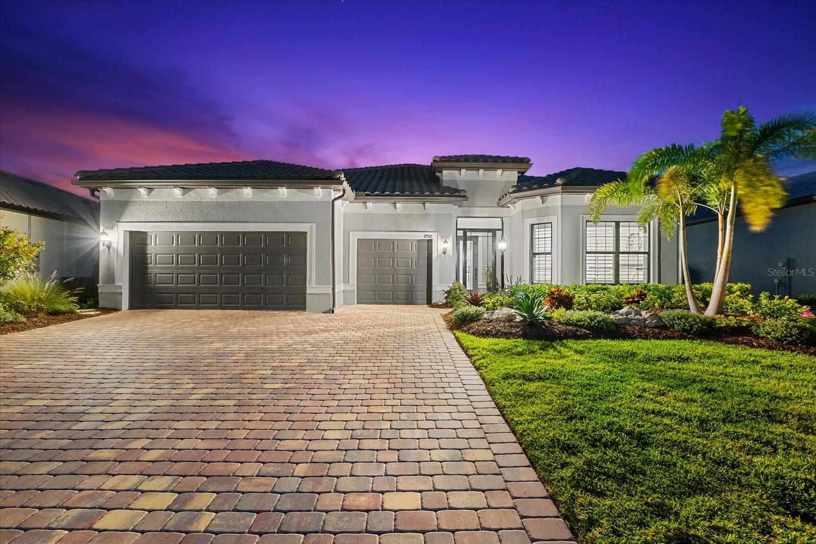 Modern Comfort Meets Resort-Style Living in Del Webb Lakewood Ranch. Welcome to easy, elegant living in the heart of Del Webb Lakewood Ranch—one of the area's most desirable 55+ communities. Set on a premium south-facing waterfront lot, this beautifully upgraded Renown floor plan offers everything you need for comfort, style, and low-maintenance Florida living. Step inside to discover an open, airy layout with 3 spacious bedrooms, 3.5 bathrooms, and a flexible bonus room—perfect for a home office, hobby space, or additional living area. Thoughtful upgrades shine throughout the home, from tray ceilings and crown molding to plantation shutters and impact-resistant windows and doors. The gourmet kitchen is a standout feature, complete with Bosch induction cooktop, built-in double ovens, stainless steel range hood, 2-zone wine fridge, wine rack, reverse osmosis system, touchless faucet, custom cabinetry, and a perfectly organized walk-in pantry. The oversized island is the heart of the home—ideal for casual dining, entertaining, or prepping meals in style. The owner’s suite is your personal retreat, featuring a luxurious bath with dual vanities, an oversized walk-in shower, private water closet, and two custom walk-in closets. Two additional guest suites, each with their own private bath and walk-in closet, offer comfort and privacy for visitors. Enjoy peace of mind with a whole-house 24kW generator, water softener system, and an extended 3-car garage with built-in storage and epoxy floors. A separate powder room, drop zone, and large laundry room add to the home’s smart and functional design. Love the outdoors? You’ll appreciate the custom-designed heated saltwater pool and spa, extended brick-paver lanai, automatic sunshades, awning, and panoramic water views—perfect for relaxing or entertaining year-round. Large pocket sliding doors open wide to blend indoor and outdoor living effortlessly. Living in Del Webb Lakewood Ranch means more than just a beautiful home—it’s a lifestyle. Enjoy access to top-tier amenities including 6 tennis courts, 8 pickleball courts, bocce ball, a fitness center with group classes, a resort-style and lap pool, on-site restaurant and bar, and endless social opportunities organized by a full-time Lifestyle Director. With close proximity to Gulf Coast beaches, airports, shopping, dining, and culture, this home truly has it all. Move-in ready and meticulously maintained—don’t miss the opportunity to make it yours.