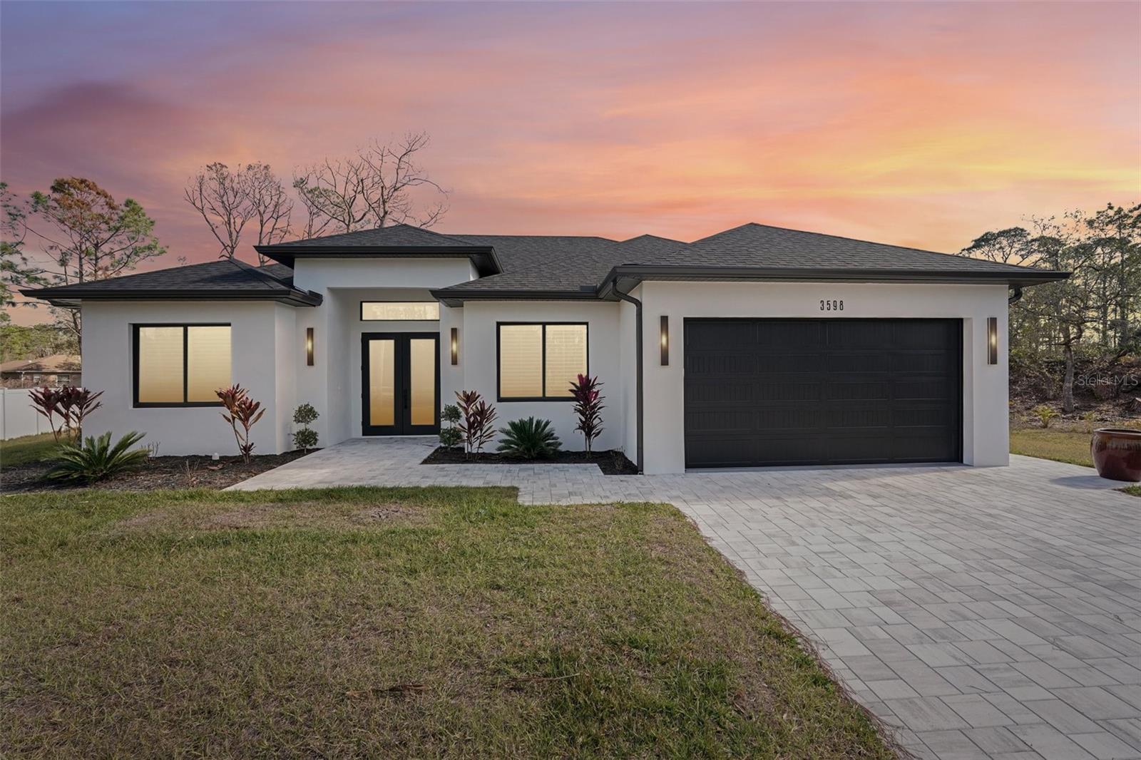 Imagine waking up every morning in this stunning, HIGH-QUALITY built 4-bedroom, 2-bathroom haven, perfectly nestled in North Port—one of the fastest-growing cities in the nation. This is more than just a house; it’s a place where luxury and comfort meet, offering an effortless, move-in-ready lifestyle with meticulous attention to detail at every turn.
Step inside and be welcomed by an expansive, light-filled living room, where soaring 12-FOOT CEILINGS and oversized windows create an airy, open feel. Picture yourself hosting lively gatherings in the chef’s dream kitchen, complete with sleek Quartz countertops, stainless steel appliances, and ample storage space to make entertaining a breeze. After a long day, retreat to the spacious primary suite, a private oasis featuring a tray ceiling, an oversized walk-in closet, and a Spa-like en-suite bathroom with a dual vanity, a free-standing soaking tub, and a luxurious walk-in shower.
Every detail of this home has been thoughtfully designed for both style and function, from the elegant luxury vinyl flooring and PLANTATION SHUTTERS to the Built-In MUDROOM and a spacious laundry room with a utility sink. The OVERSIZE DRIVEWAY and IMPACT-INSULATED WINDOWS AND DOORS ensure convenience and security, making this home truly hurricane-ready.
Step outside to the expansive covered lanai, where you can sip your morning coffee or unwind in the evening, surrounded by the tranquility of the GREENBELT. With no HOA fees, an oversized lot, and a prime location in Sarasota County’s highly rated school district, this home offers the perfect blend of privacy and accessibility. Just minutes from I-75, shopping, dining, and the breathtaking Gulf beaches, your dream lifestyle awaits.
This is more than just a home—it’s the one you’ve been waiting for. PICKY AND DISERNING BUYERS this is not a cookie cutter new construction home! Don’t let this opportunity slip away—call today to make it yours!