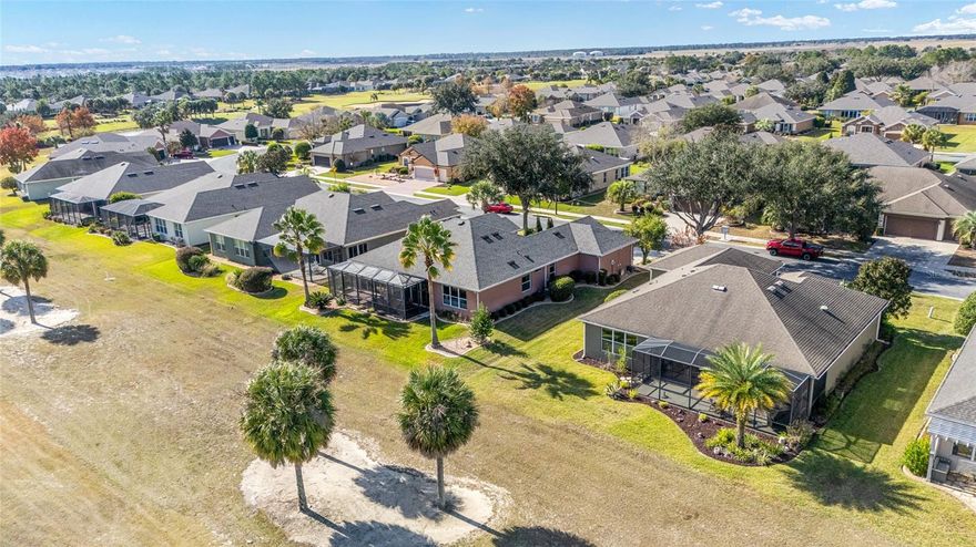 This perfectly positioned GOLF-FRONT, HANOVER MODEL in the sought-after Del Webb Stone Creek 55+ community has been meticulously maintained and is move-in ready! This 3/2 home offers a golf cart garage and 1,958 SF of comfort, style, and serene Florida living. Built in 2007, the home has been thoughtfully updated to provide peace of mind and modern appeal, all while embracing breathtaking fairway views. Step inside to discover a bright and open layout enhanced by a view of the fairway and an abundance of natural light coming from the enclosed lanai that captures your attention as soon as you walk into the home.  Let your mornings begin with tea or coffee overlooking the rolling greens, and evenings end with a cocktail with loved ones or friends as you watch the colorful sunset shades across the golf course—this is the perfect little retreat.  Best of all, you can have peace of mind knowing that this home includes a brand-new roof (2025), epoxy garage floor (2024), luxury vinyl plank flooring (updated in 2022), and HVAC replacement (2017). The kitchen cabinets have also recently been painted, most of the appliances are less than five years old, and the gorgeous quartz countertops give a sense of elegance to the kitchen, making this home truly move-in ready. The golf cart's additional space in the garage gives you ample space for hobbies or extra storage. Your new life will definitely be enhanced by your new lifestyle in Stone Creek, which is all about connection, activity, and ease. Residents enjoy world-class amenities, including championship golf, resort-style indoor and outdoor pools, fitness and wellness centers, miles of walking and biking trails, softball, pickleball, tennis, and over 100 clubs and social activities. Here, every day feels like a vacation—yet home always feels peaceful and refined. Stone Creek is nestled in the heart of Florida’s horse country. Ocala offers a charming blend of nature, culture, and convenience. You’re just minutes from shopping, dining, medical facilities, the famous World Equestrian Center, and not far from the historic Downtown Ocala, known for its local eateries, art scene, and seasonal events. This is more than a home—it’s a lifestyle defined by beauty, leisure, and effortless living. Golf-front views, thoughtful updates, and the unmatched Stone Creek experience make this well-cared-for home a truly special place to call home.