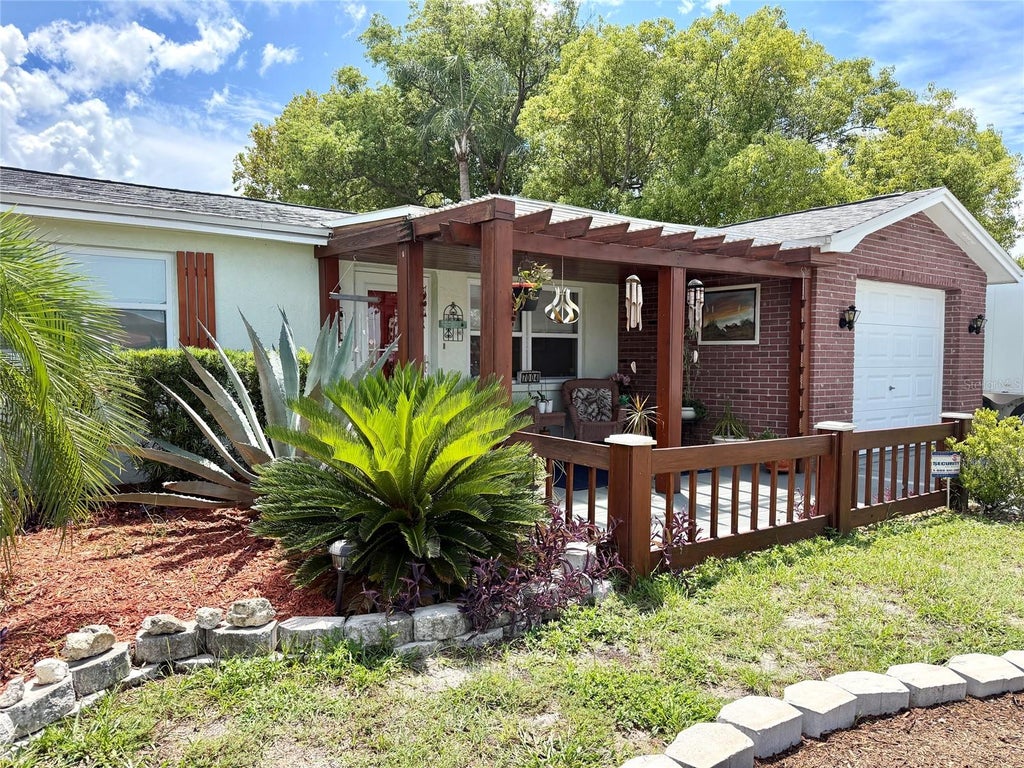 Photo of 7004 Rockwood Dr, Port Richey, FL 34668 (MLS # W7889060)