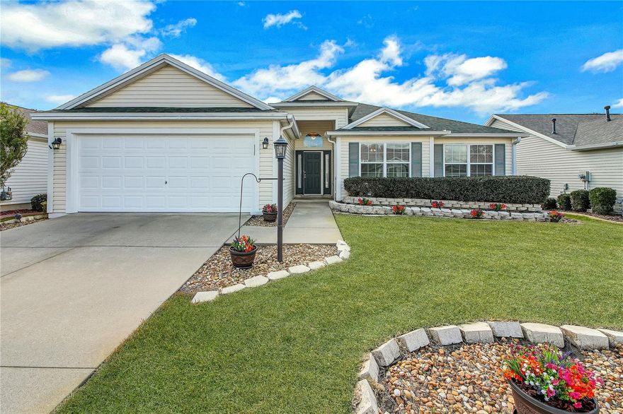 Lovely 3/2/2 Oleander Designer Model Home in the desirable Village of Woodbury!   This home offers soaring ceilings, freshly painted interior and tons of natural light while boasting a generous 1640 sq ft heated.   Peace of mind awaits as the following have been replaced:  New Roof (04/2020), New HVAC (09/2020), tankless water heater and Solar Panels (around 2021-paid in full)! No Carpet here, just lovely laminate and tile flooring!  Large Kitchen with pullouts and a convenient eat-in kitchen nook and for more formal dining, the separate dining room awaits.   The primary bedroom has a very large walk in closet while the en-suite features dual sinks and a large walk in shower with a seat.   The two guest bedrooms are a good size and the guest bathroom is a tub/shower combo.  Another BONUS is the Laundry Room is INSIDE plus it has storage!  Both the garage floors and the lanai floor have recently been painted.  The lanai is quite spacious; its L-shape gives you privacy on one side.  This is a BEAUTIFUL home on a quiet street with a lovely setting in the back. GREAT location close to Mulberry Grove shopping, Restaurants, Publix, VA Center, First Responders Recreation and so much more! ALL THIS AND THE CONVENIENCE OF A GOLF CART RIDE TO THE NANCY LOPEZ CHAMPIONSHIP GOLF COURSE, REGIONAL RECREATION CENTER AND MULBERRY PLAZA.