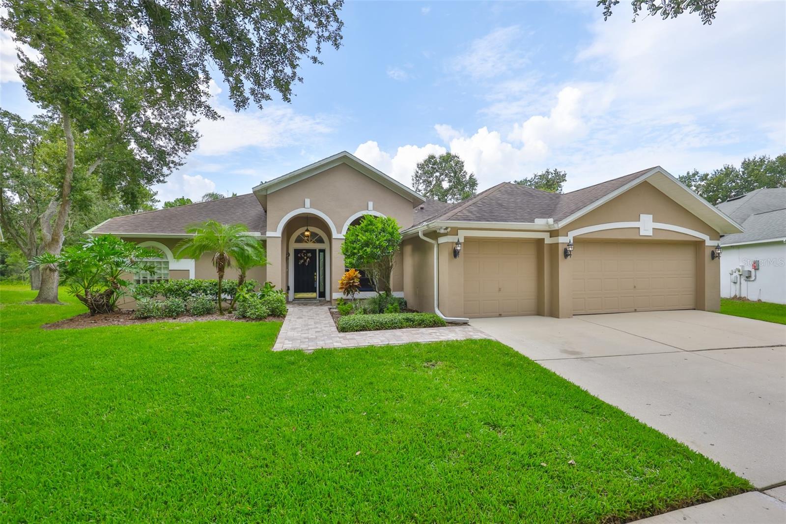 Stunning Lakefront Pool Home in Desirable West Meadows
Welcome to your dream home in the heart of sunny Tampa, Florida! Nestled in the sought-after community of West Meadows, this beautifully maintained 4-bedroom, 3-bathroom, 3-car garage pool home offers the perfect blend of luxury, comfort, and breathtaking natural beauty.
From the moment you arrive, you'll be captivated by the home's impressive curb appeal. An elegant archway entrance, manicured lawn, mature trees, and tasteful exterior lighting create a warm and inviting first impression. Inside, gleaming laminate floors, soaring ceilings, and abundant natural light enhance the open, airy feel of the space.
This home is ideally situated on a rare pie-shaped lot, maximizing privacy and providing panoramic views of a serene lake and lush conservation area, like having your own private island right in your backyard! The screened lanai and paver pool deck are perfect for relaxing or entertaining while enjoying the Florida sunshine and tranquil water views.
The heart of the home is the updated kitchen, which seamlessly flows into the dinette and living areas. You'll love the granite countertops, tall white cabinetry, stainless steel appliances, breakfast bar, and elegant fixtures. Whether you're hosting a gathering or enjoying a quiet morning coffee, this space offers comfort and functionality.
The split-bedroom floor plan offers maximum privacy, with the luxurious primary suite tucked away in its own wing. Here, you'll find sliding glass doors leading to the lanai, a spacious layout to accommodate any furniture, and a spa-like ensuite bath complete with double vanities, a walk-in shower, soaking tub, and a generous walk-in closet.
The additional bedrooms are equally spacious and bright, with large windows, ceiling fans, and ample closet space. One bedroom and full bath are perfectly positioned for guests or multigenerational living, while the remaining two bedrooms share a well-appointed third bathroom.
Step outside to your private screened porch, where you can enjoy year-round outdoor living with uninterrupted views of the lake and surrounding landscape, a true sanctuary.
As a resident of West Meadows, you'll also enjoy access to the exclusive community clubhouse, featuring resort-style amenities including multiple pools (one with a thrilling slide), tennis courts, a fitness center, and more.
This exceptional home offers everything you've been searching for: scenic views, a spacious layout, luxurious finishes, and access to top-tier community features. Don't miss the opportunity to make this slice of paradise your own!