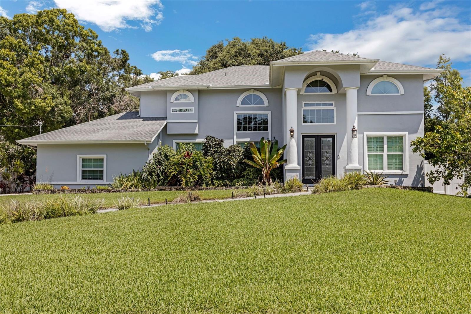 One or more photo(s) has been virtually staged. Must see this 4 bedroom/2.5 bath home with almost 2700 Sq/Ft on one of the highest/majestic lots in downtown Oldsmar! Relax by the wood fireplace with your family in the comfortable living room! Entertain guests, make a fire-pit area, or start your own garden in the expansive backyard with Lanai! Lot is almost a half acre! Fantastic kitchen with granite countertops, stainless steel appliances, plenty of wood cabinets/countertop space and breakfast bar! Large master bedroom with enormous walk-in closet and newly updated master bath with soaking tub, his-and-her sinks and high end stone tile throughout! Take the private glass vacuum elevator to the second floor! Also a dining area, family room and office! Some additional upgrades include: High ceilings, sprinkler system, hurricane windows, whole house instant hot water, water softener/filter system, updated flooring throughout, vinyl fencing, smart-home switches/recessed lighting, updated 2 car garage, block home. Short walk to Bicentennial Park that has a dog park, playground, tennis/basketball/pickleball courts. Also near boat launch, hiking/biking trails, library, fishing pier, museum and schools. Home had no hurricane/water damage! Oldsmar is located centrally in north Pinellas County and is a short drive to world class gulf beaches, Tampa International Airport, sporting venues, theater, shopping, restaurants and much, much more!