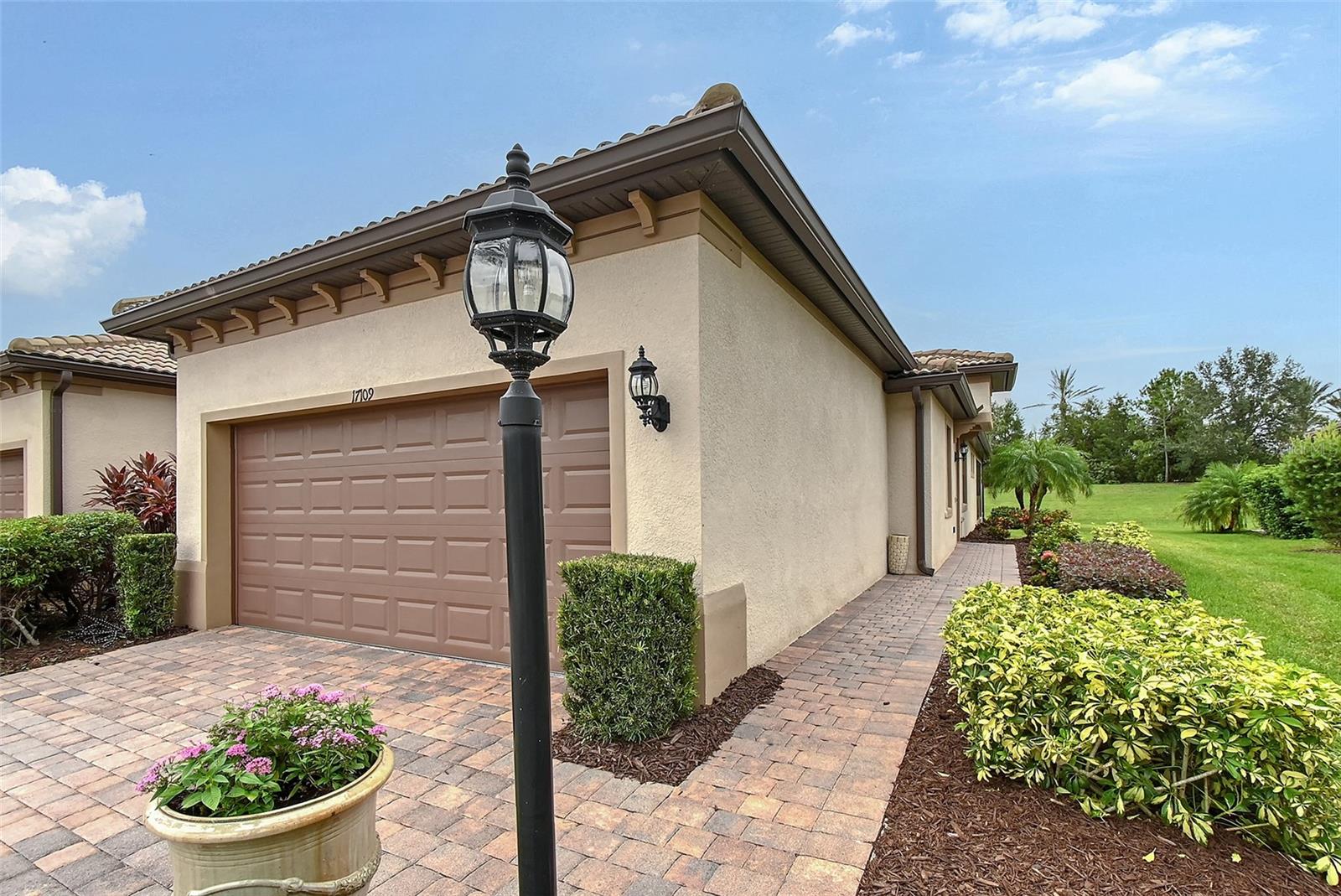 Nestled in the heart of Del Webb—Pulte Homes’ Crown Jewel 55 Plus community—this fully enhanced 2 bedroom, 2 bath with large office Serenity Model is a rare find, blending style, comfort, and a resort-like lifestyle. NOTEWORTHY FEATURES of this home are the 16 x 14 conditioned FLORIDA ROOM with HURRICANE IMPACT WINDOWS AND DOORS, custom shades, gorgeous concrete flooring and great built in bar. Also includes a screened lanai. You will love the stunning engineered hardwood flooring throughout! Virtually walk through this home by viewing the Matterport 3D Tour! Step inside to a bright, open-concept layout with quality features such as tray ceilings in the office and primary bedrooms. This homeowner enhanced this home with many new updates such as new quartz counters, faucets, Murano dining fixture, plantation shutters, new washer and dryer to list a few. The kitchen is a chef’s dream, boasting new quartz countertops, Reverse osmosis faucet, a Bosch dishwasher, gas appliances, a gourmet layout, and a stylish backsplash that makes cooking and entertaining effortless. Unwind in the spacious glass-enclosed Florida room with a built in bar, equipped with conditioned air and custom shades for year-round comfort.The split-bedroom floor plan offers ideal privacy for guests. The office, adorned with French glass doors and a custom closet, is perfect for working from home and is versatile enough for guests as a third bedroom. The luxurious primary suite impresses with custom-designed closets, updated finishes, and a spa-inspired bathroom with a deep soaking tub and newer bidet in the water closet. You will appreciate the whole house water filtration system as well. Furniture can be purchased separate outside of contract. The garage includes epoxy-finished flooring and built in storage. The newly enhanced landscaping adds a colorful enhancement to the peaceful setting. Golf cart-friendly streets make it easy to explore the vibrant surroundings. Whether you're heading to the tennis or pickleball courts, taking a dip in one of the resort-style pools, joining a fitness class, or enjoying happy hour with live music at the Lake House Restaurant, there’s always something happening. A full-time lifestyle director and endless social clubs ensure you’ll never run out of ways to connect and engage. This exceptional home is more than just a place to live—it’s an invitation to embrace the Florida lifestyle you've been dreaming of. Schedule your preview of this beautiful home today! Located in award-winning Lakewood Ranch, the #1 multigenerational master-planned community in the nation, you’ll be just minutes from world-class shopping, top-rated beaches, dining, and medical facilities. It's your time to enjoy!