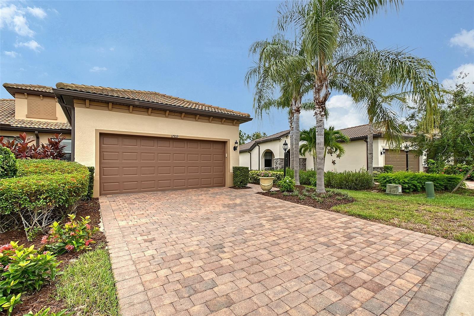 Nestled in the heart of Del Webb—Pulte Homes’ Crown Jewel 55 Plus community—this fully enhanced 2 bedroom, 2 bath with large office Serenity Model is a rare find, blending style, comfort, and a resort-like lifestyle. NOTEWORTHY FEATURES of this home are the 16 x 14 conditioned FLORIDA ROOM with HURRICANE IMPACT WINDOWS AND DOORS, custom shades, gorgeous concrete flooring and great built in bar. Also includes a screened lanai. You will love the stunning engineered hardwood flooring throughout! Virtually walk through this home by viewing the Matterport 3D Tour! Step inside to a bright, open-concept layout with quality features such as tray ceilings in the office and primary bedrooms. This homeowner enhanced this home with many new updates such as new quartz counters, faucets, Murano dining fixture, plantation shutters, new washer and dryer to list a few. The kitchen is a chef’s dream, boasting new quartz countertops, Reverse osmosis faucet, a Bosch dishwasher, gas appliances, a gourmet layout, and a stylish backsplash that makes cooking and entertaining effortless. Unwind in the spacious glass-enclosed Florida room with a built in bar, equipped with conditioned air and custom shades for year-round comfort.The split-bedroom floor plan offers ideal privacy for guests. The office, adorned with French glass doors and a custom closet, is perfect for working from home and is versatile enough for guests as a third bedroom. The luxurious primary suite impresses with custom-designed closets, updated finishes, and a spa-inspired bathroom with a deep soaking tub and newer bidet in the water closet. You will appreciate the whole house water filtration system as well. Furniture can be purchased separate outside of contract. The garage includes epoxy-finished flooring and built in storage. The newly enhanced landscaping adds a colorful enhancement to the peaceful setting. Golf cart-friendly streets make it easy to explore the vibrant surroundings. Whether you're heading to the tennis or pickleball courts, taking a dip in one of the resort-style pools, joining a fitness class, or enjoying happy hour with live music at the Lake House Restaurant, there’s always something happening. A full-time lifestyle director and endless social clubs ensure you’ll never run out of ways to connect and engage. This exceptional home is more than just a place to live—it’s an invitation to embrace the Florida lifestyle you've been dreaming of. Schedule your preview of this beautiful home today! Located in award-winning Lakewood Ranch, the #1 multigenerational master-planned community in the nation, you’ll be just minutes from world-class shopping, top-rated beaches, dining, and medical facilities. It's your time to enjoy!